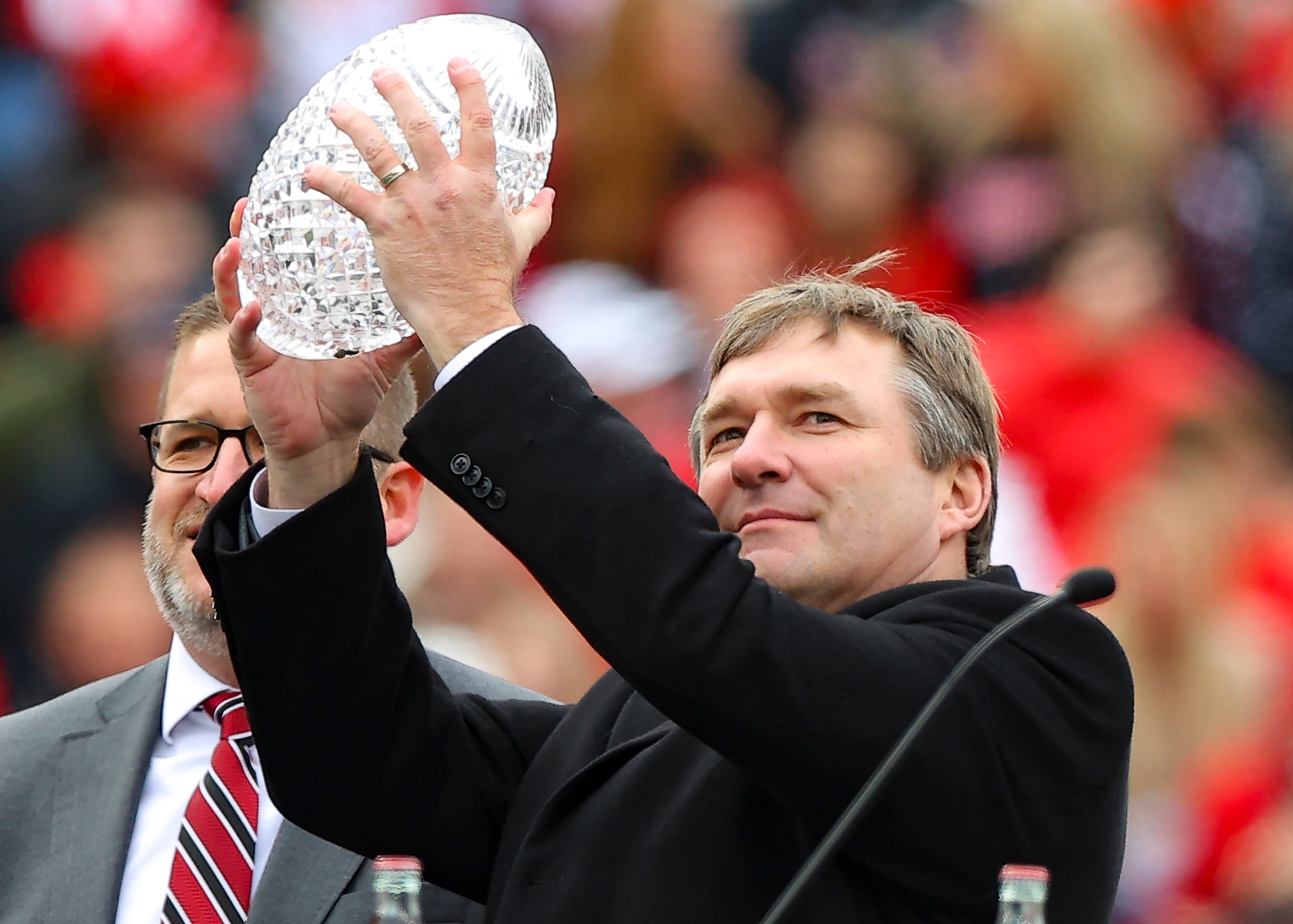 ATHENS, GA - JANUARY 15: Head coach Kirby Smart of the Georgia Bulldogs holds up the coaches trophy during the celebration honoring the Georgia Bulldogs national championship victory on January 15, 2022 in Athens, Georgia. (Photo by Todd Kirkland/Getty Images)