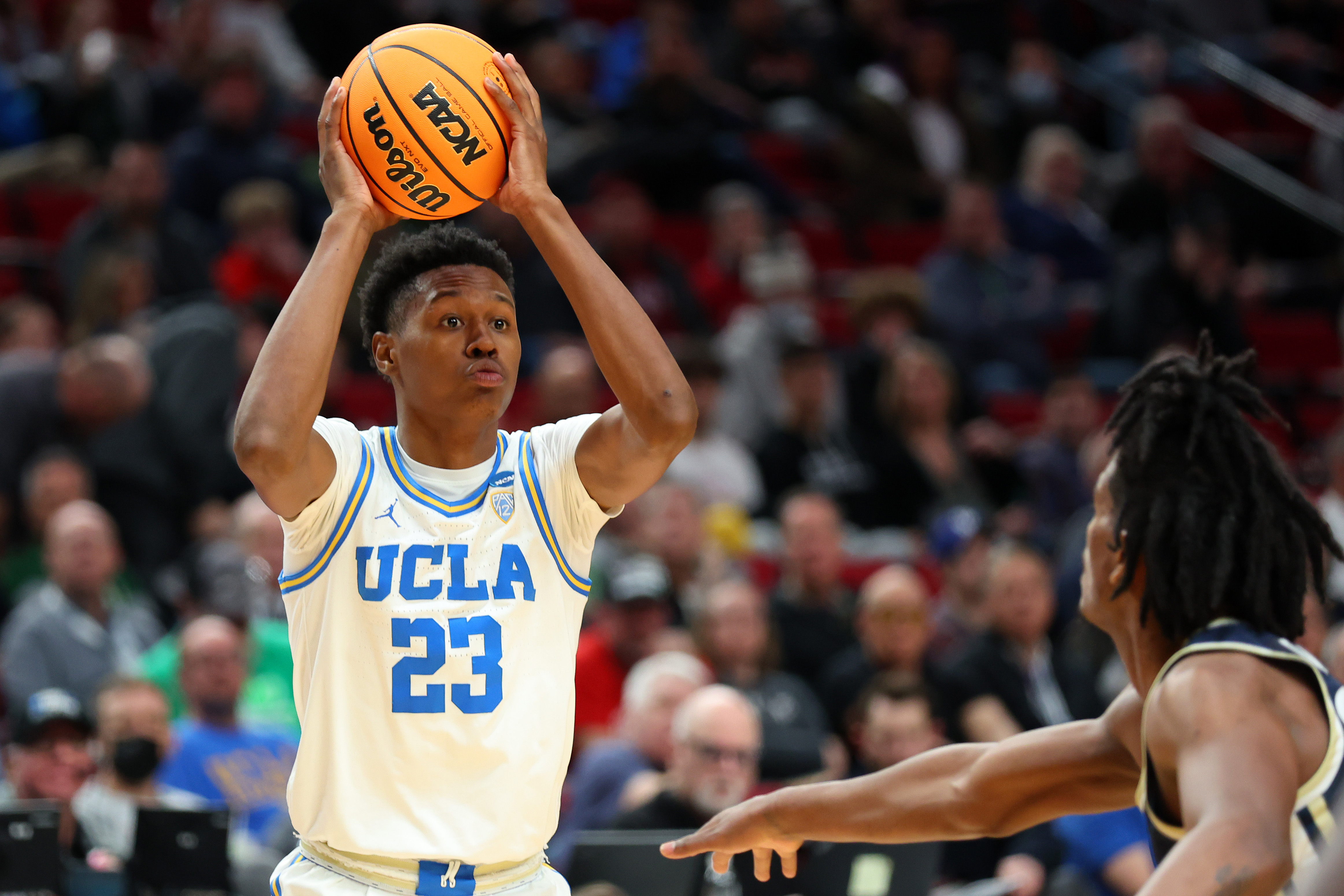 PORTLAND, OREGON - MARCH 17: Peyton Watson #23 of the UCLA Bruins looks to pass against the UCLA Bruins in the first round game of the 2022 NCAA Men's Basketball Tournament at Moda Center on March 17, 2022 in Portland, Oregon. (Photo by Abbie Parr/Getty Images)