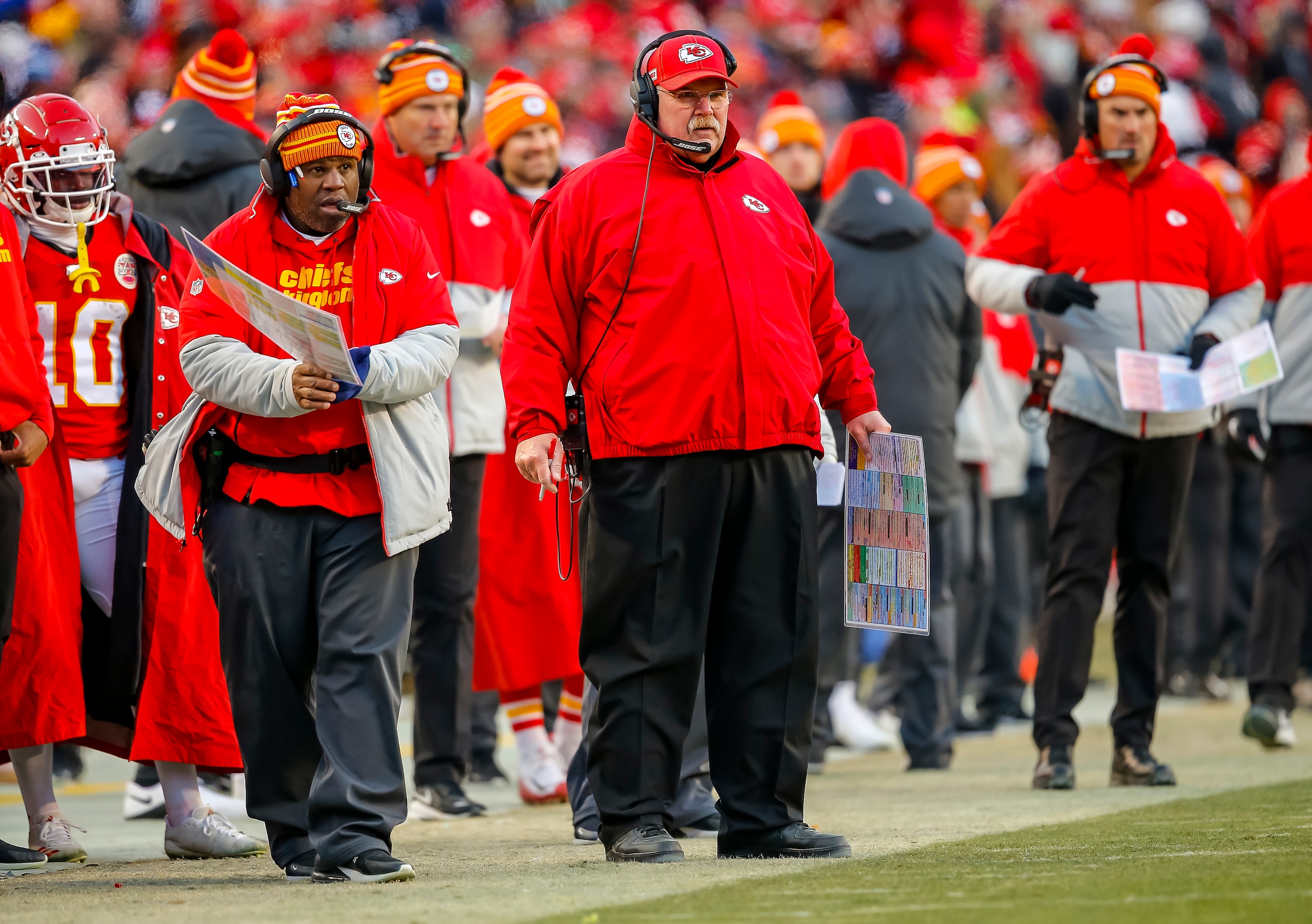 KANSAS CITY, MO - JANUARY 19: Kansas City Chiefs offensive coordinator Eric Bieniemy watches fourth quarter game action with head coach Andy Reid of the Kansas City Chiefs during the third quarter of the AFC Championship game against the Tennessee Titans at Arrowhead Stadium on January 19, 2020 in Kansas City, Missouri. (Photo by David Eulitt/Getty Images)