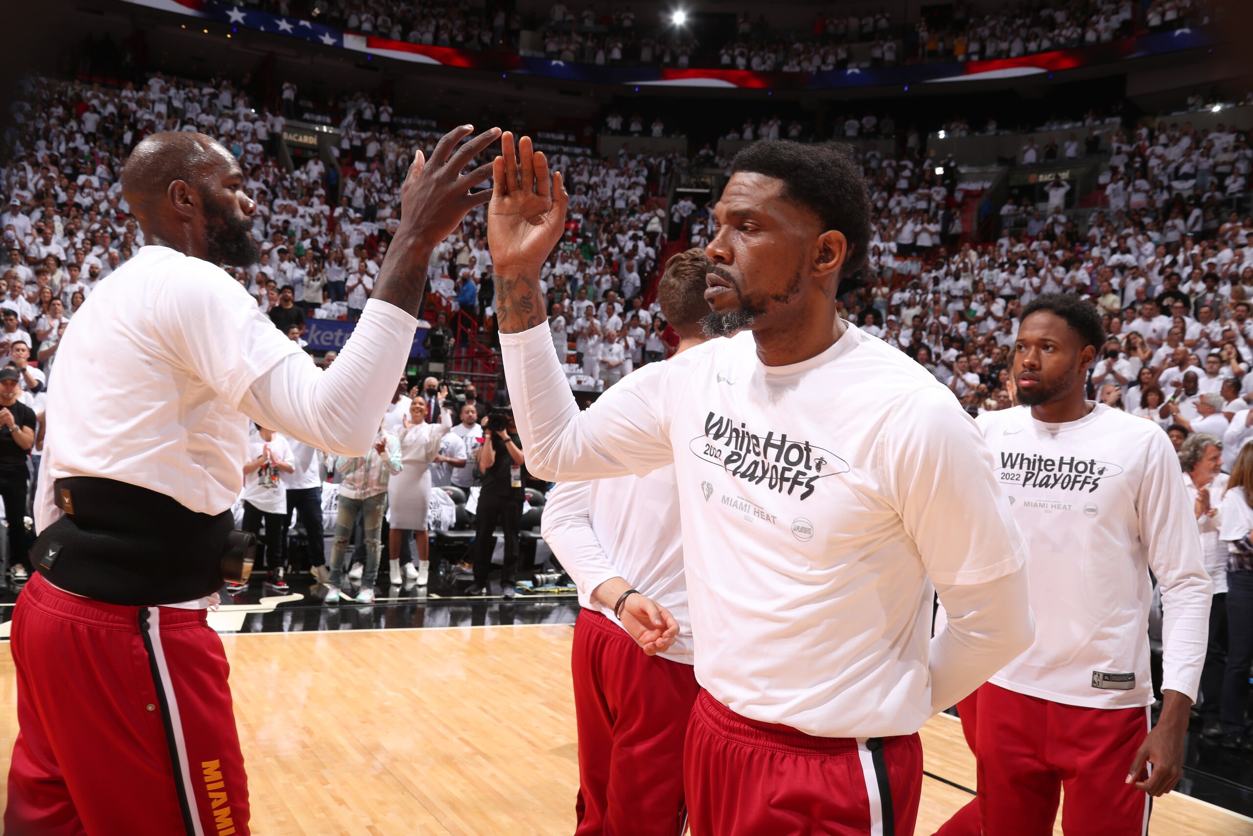 MIAMI, FL - MAY 25: Dewayne Dedmon #21 of the Miami Heat high fives Udonis Haslem #40 prior to the game against the Boston Celtics during Game 5 of the 2022 NBA Playoffs Eastern Conference Finals on May 25, 2022 at FTX Arena in Miami, Florida. NOTE TO USER: User expressly acknowledges and agrees that, by downloading and or using this Photograph, user is consenting to the terms and conditions of the Getty Images License Agreement. Mandatory Copyright Notice: Copyright 2022 NBAE (Photo by Issac Baldizon/NBAE via Getty Images)