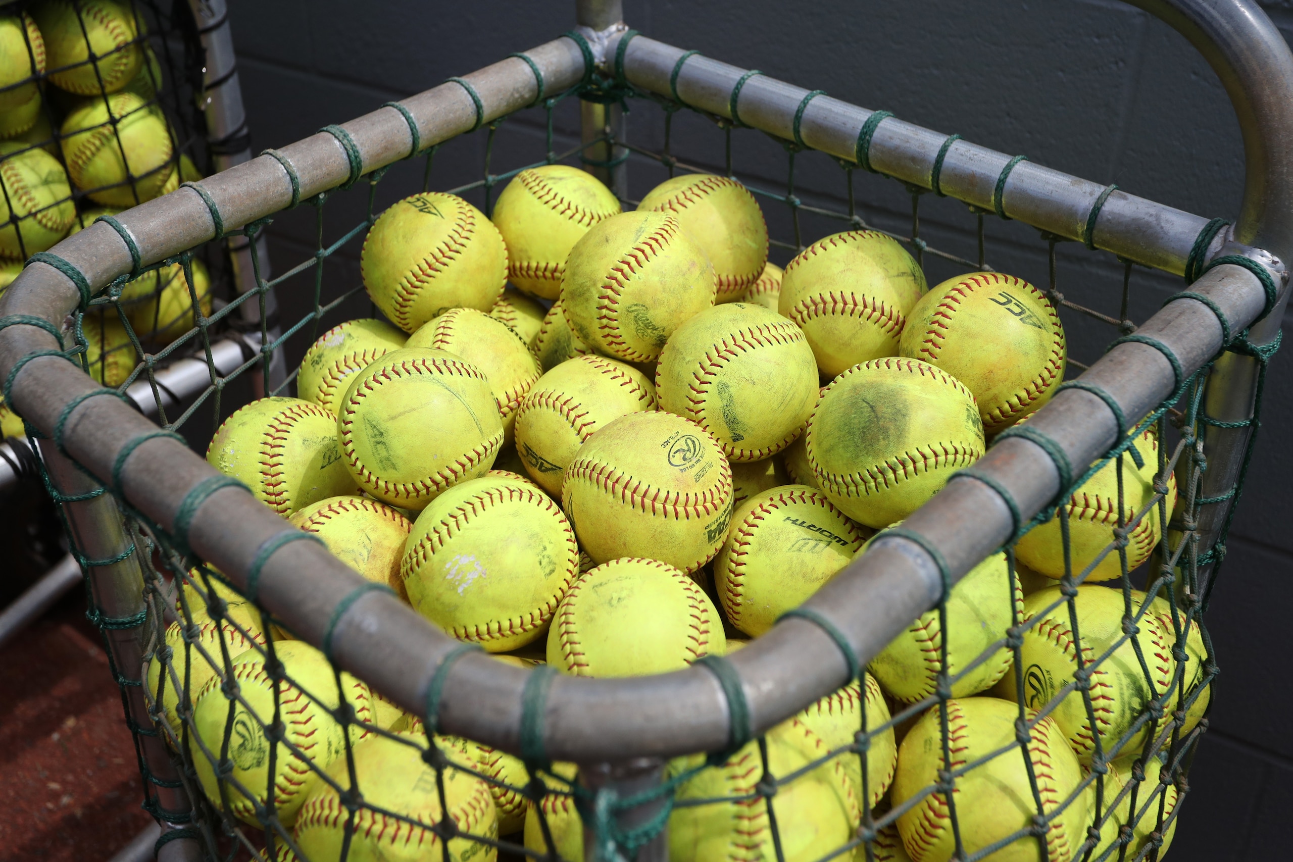 RALEIGH, NC - MAY 07: A basket of softballs in the home team bullpen. The North Carolina State University Wolfpack hosted the University of Louisville Cardinals on May 7, 2017, at Dail Softball Stadium in Raleigh, NC in a Division I College Softball game. Louisville won the game 7-0. (Photo by Andy Mead/YCJ/Icon Sportswire via Getty Images) RALEIGH, NC - MAY 07: A basket of softballs in the home team bullpen. The North Carolina State University Wolfpack hosted the University of Louisville Cardinals on May 7, 2017, at Dail Softball Stadium in Raleigh, NC in a Division I College Softball game. Louisville won the game 7-0. (Photo by Andy Mead/YCJ/Icon Sportswire via Getty Images)