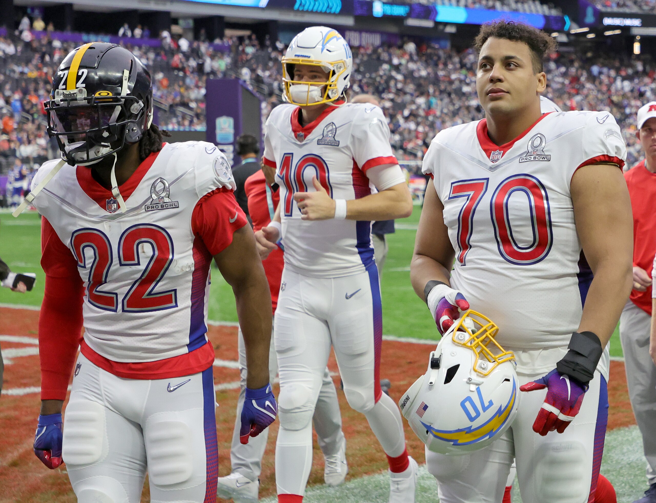 LAS VEGAS, NEVADA - FEBRUARY 06:  AFC players Najee Harris #22 of the Pittsburgh Steelers and Justin Herbert #10 and Rashawn Slater #70 of the Los Angeles Chargers walk off the field at halftime of the 2022 NFL Pro Bowl against the NFC at Allegiant Stadium on February 06, 2022 in Las Vegas, Nevada. The AFC defeated the NFC 41-35.  (Photo by Ethan Miller/Getty Images)
