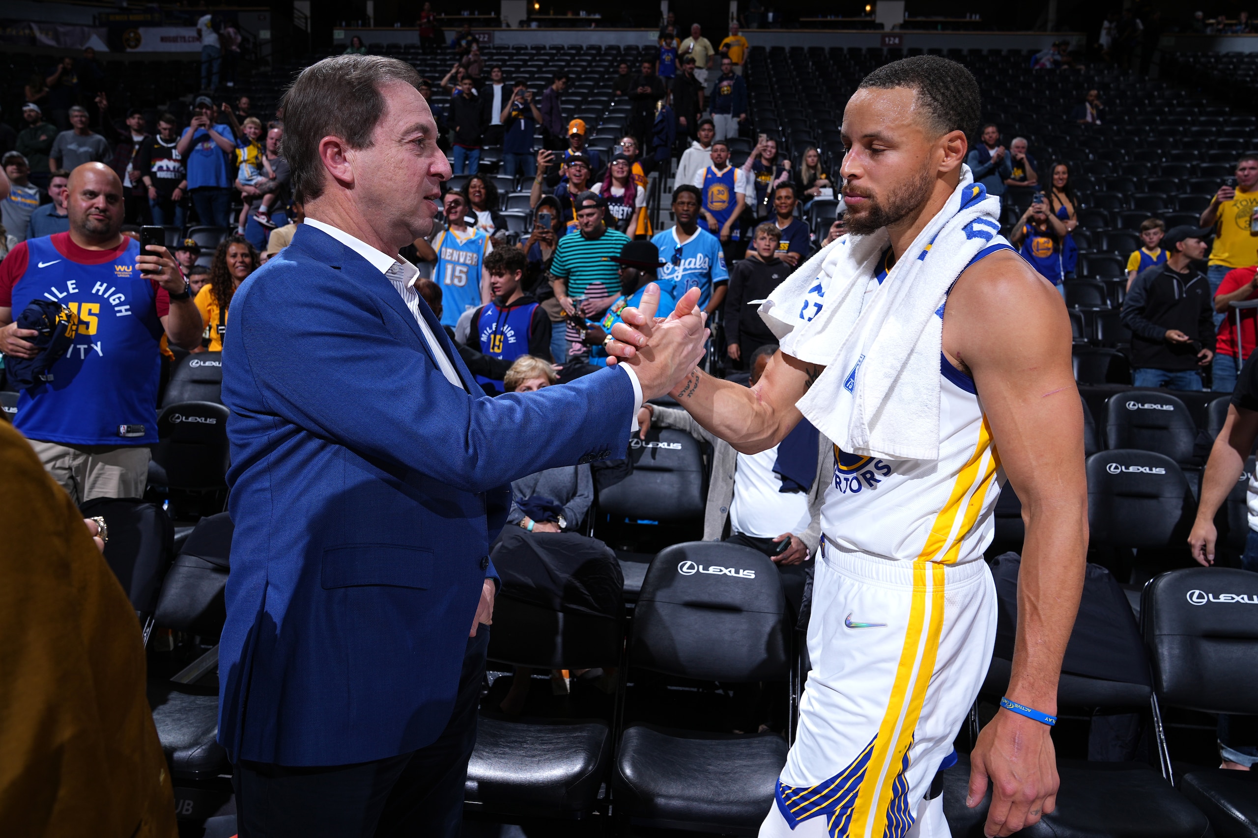 DENVER, CO - APRIL 21: Chairman and CEO of the Golden State Warriors, Joe Lacob and Stephen Curry #30 of the Golden State Warriors embrace after the game against the Denver Nuggets during Round 1 Game 3 of the 2022 NBA Playoffs on April 21, 2022 at the Ball Arena in Denver, Colorado. NOTE TO USER: User expressly acknowledges and agrees that, by downloading and/or using this Photograph, user is consenting to the terms and conditions of the Getty Images License Agreement. Mandatory Copyright Notice: Copyright 2022 NBAE (Photo by Garrett Ellwood/NBAE via Getty Images)