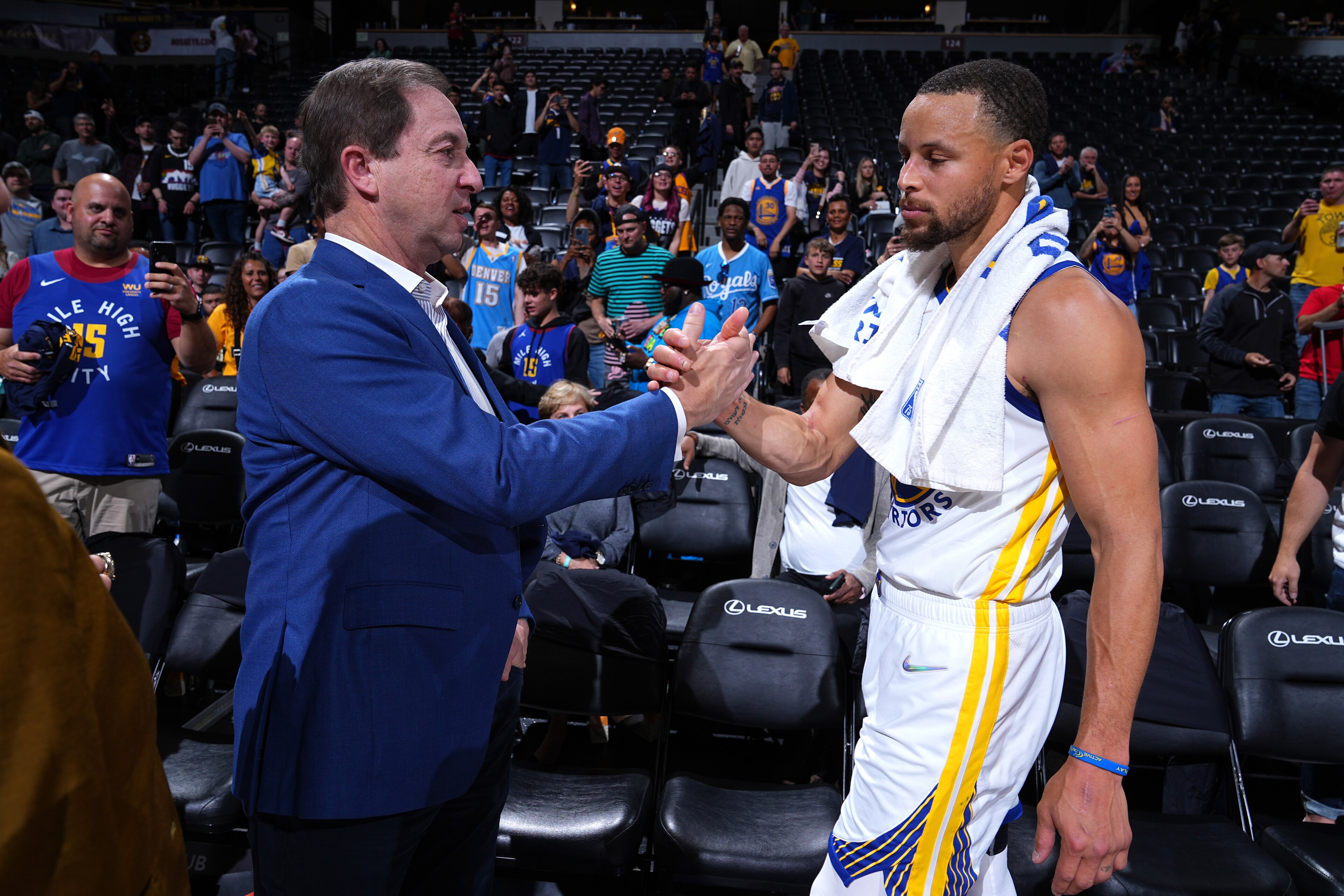 DENVER, CO - APRIL 21: Chairman and CEO of the Golden State Warriors, Joe Lacob and Stephen Curry #30 of the Golden State Warriors embrace after the game against the Denver Nuggets during Round 1 Game 3 of the 2022 NBA Playoffs on April 21, 2022 at the Ball Arena in Denver, Colorado. NOTE TO USER: User expressly acknowledges and agrees that, by downloading and/or using this Photograph, user is consenting to the terms and conditions of the Getty Images License Agreement. Mandatory Copyright Notice: Copyright 2022 NBAE (Photo by Garrett Ellwood/NBAE via Getty Images)