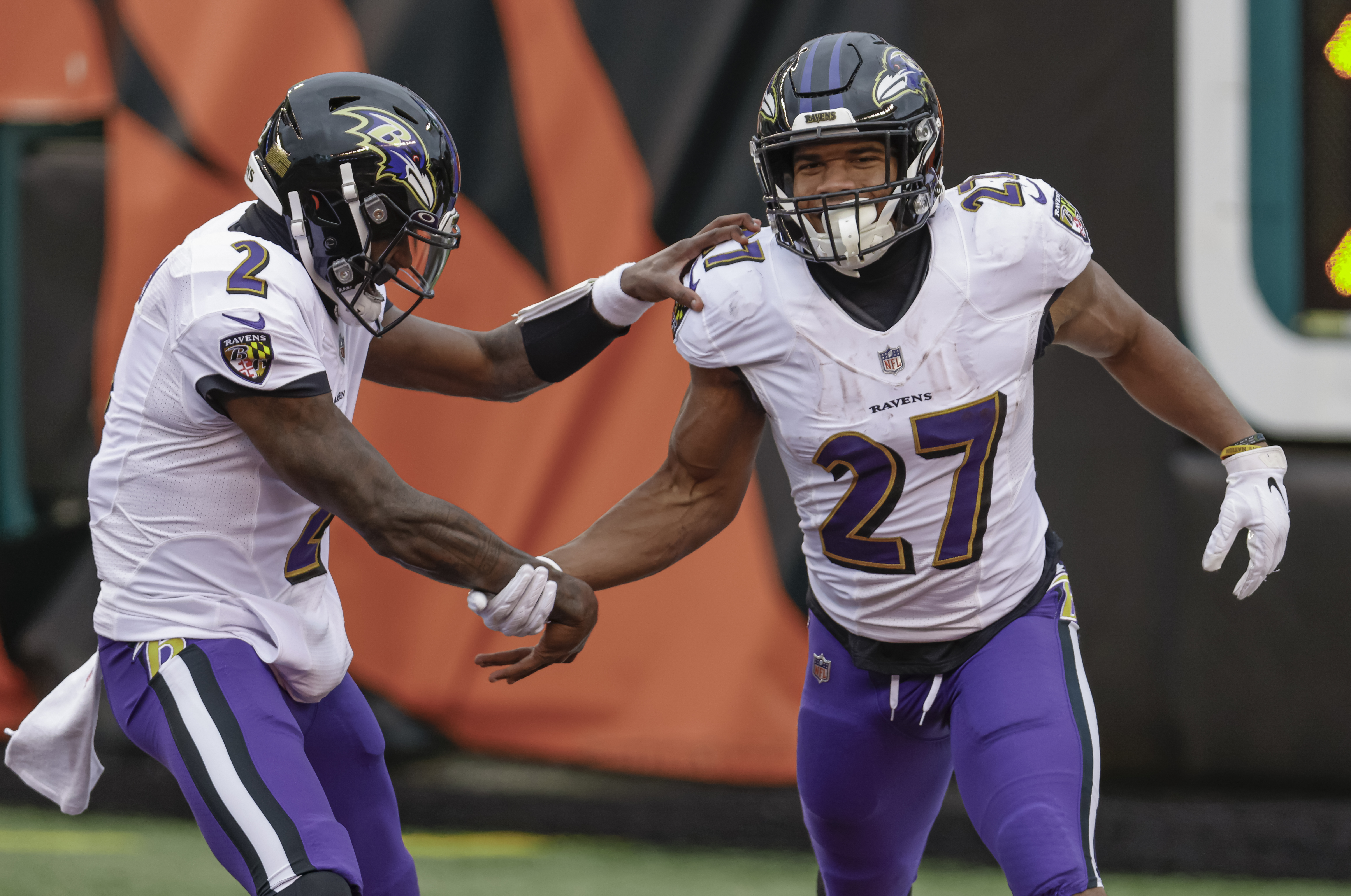 CINCINNATI, OHIO - JANUARY 03: Tyler Huntley #2 and J.K. Dobbins #27 of the Baltimore Ravens celebrate during the game against the Cincinnati Bengals at Paul Brown Stadium on January 03, 2021 in Cincinnati, Ohio. (Photo by Michael Hickey/Getty Images)