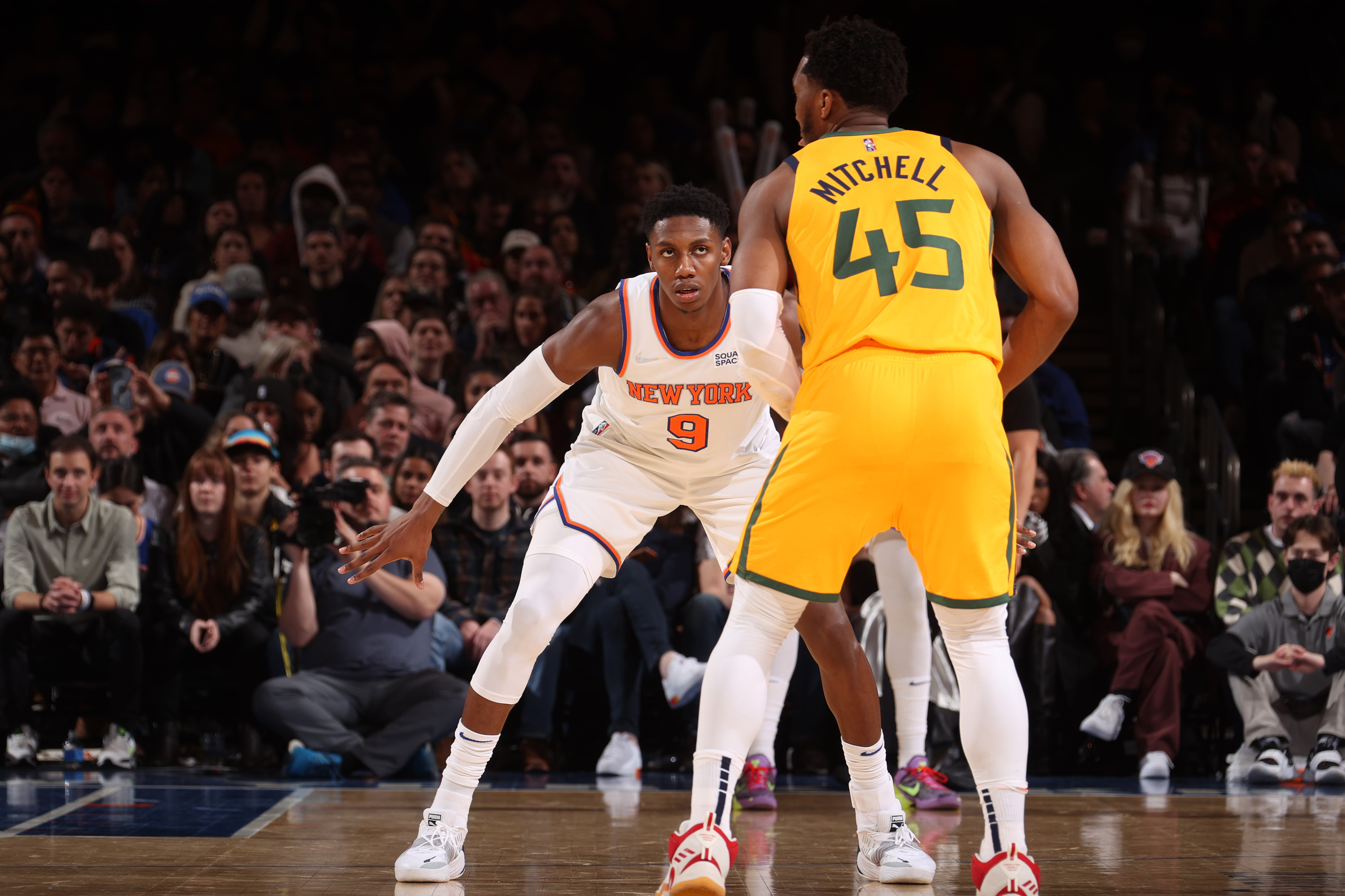 NEW YORK, NY - MARCH 20: RJ Barrett #9 of the New York Knicks plays defense on Donovan Mitchell #45 of the Utah Jazz during the game on March 20, 2022 at Madison Square Garden in New York City, New York. NOTE TO USER: User expressly acknowledges and agrees that, by downloading and or using this photograph, User is consenting to the terms and conditions of the Getty Images License Agreement. Mandatory Copyright Notice: Copyright 2022 NBAE (Photo by Nathaniel S. Butler/NBAE via Getty Images)