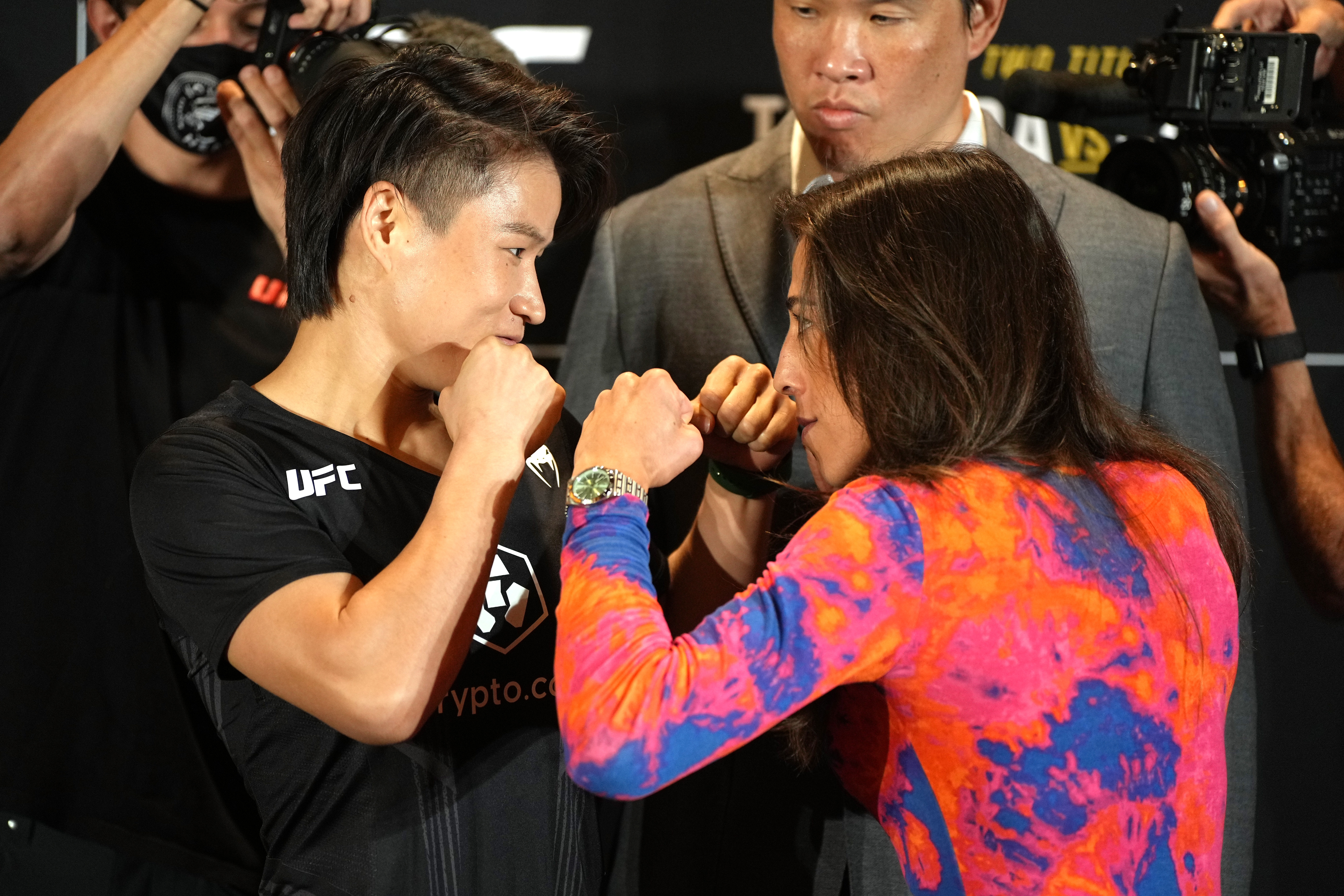 SINGAPORE, SINGAPORE - JUNE 08: (L-R) Weili Zhang of China and Joanna Jedrzejczyk of Poland face off during the UFC 275 media day at Mandarin Oriental on June 08, 2022 in Singapore. (Photo by Jeff Bottari/Zuffa LLC)