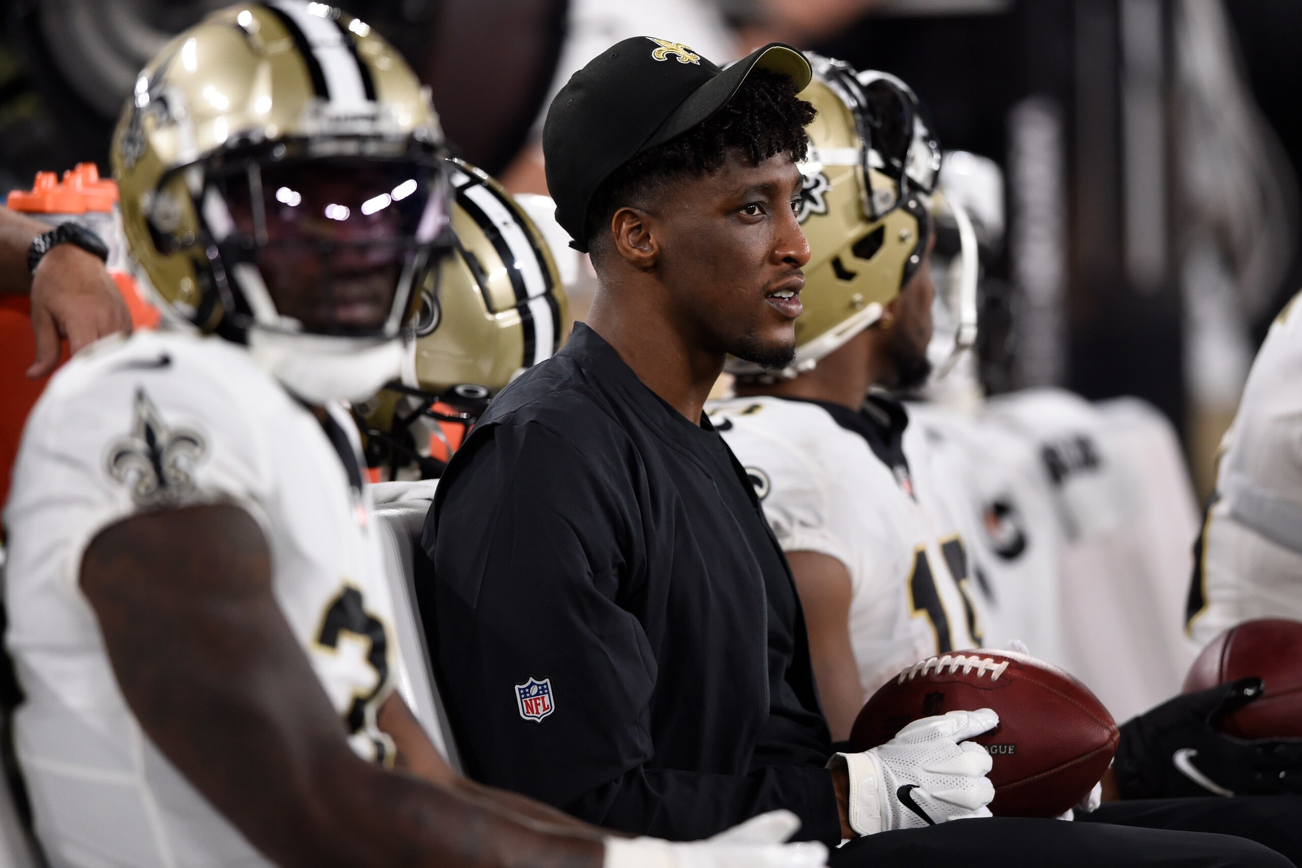 FILE - New Orleans Saints wide receiver Michael Thomas, center, sits on the bench with teammates during the second half of an NFL preseason football game against the Baltimore Ravens, Saturday, Aug. 14, 2021, in Baltimore. Thomas says he won't be able to play this season because of complications related to his recovery from offseason ankle surgery. Saints coach Sean Payton said Thomas will need an additional procedure, but he also credited Thomas' work ethic during his rehabilitation and said the setback had nothing to do with the receiver's approach to his recovery. Thomas posted comments about his setback on social media Wednesday, Nov. 3. (AP Photo/Gail Burton, File) FILE - New Orleans Saints wide receiver Michael Thomas, center, sits on the bench with teammates during the second half of an NFL preseason football game against the Baltimore Ravens, Saturday, Aug. 14, 2021, in Baltimore. Thomas says he won't be able to play this season because of complications related to his recovery from offseason ankle surgery. Saints coach Sean Payton said Thomas will need an additional procedure, but he also credited Thomas' work ethic during his rehabilitation and said the setback had nothing to do with the receiver's approach to his recovery. Thomas posted comments about his setback on social media Wednesday, Nov. 3. (AP Photo/Gail Burton, File)