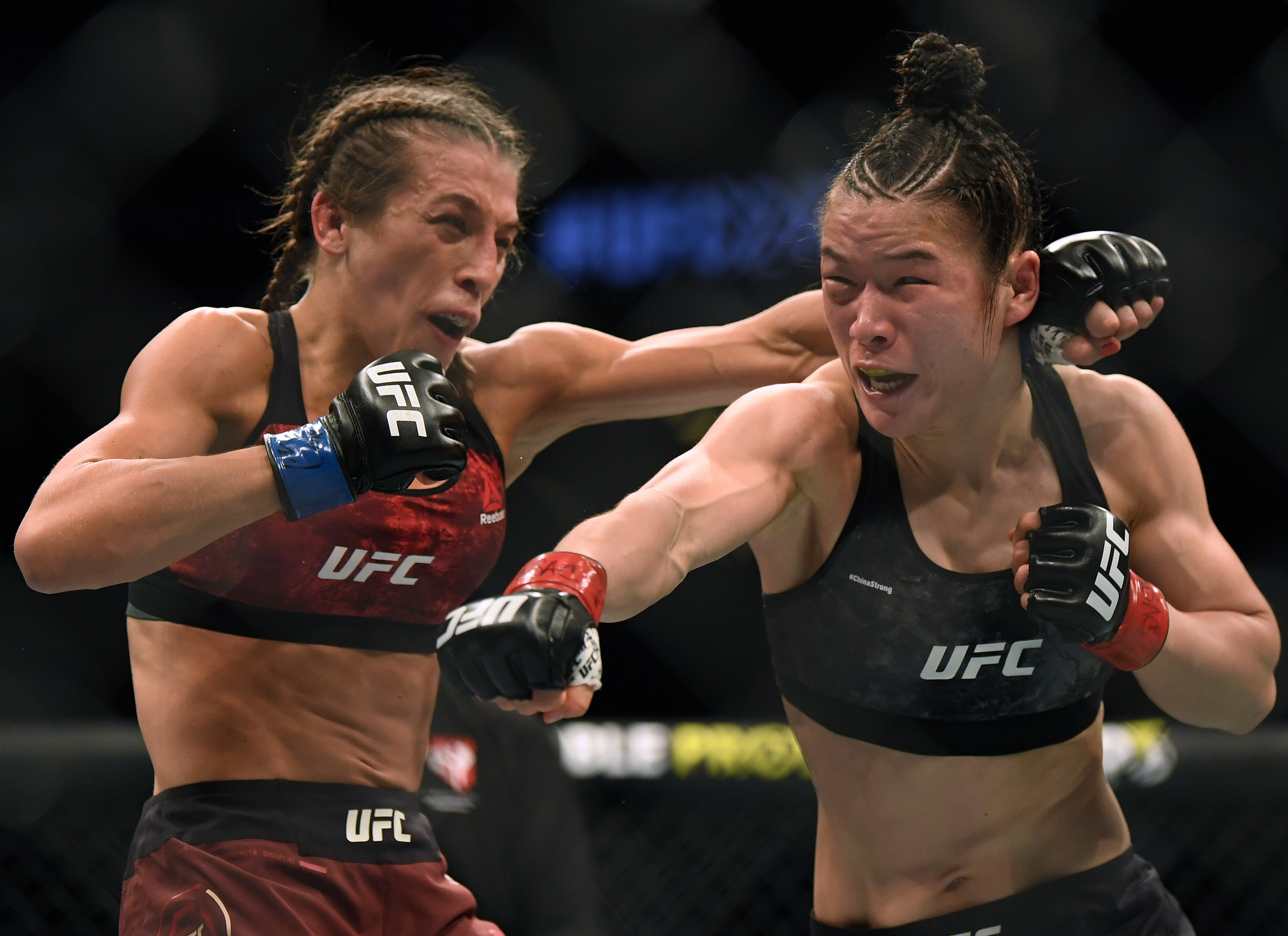 LAS VEGAS, NEVADA - MARCH 07:    Weili Zhang punches Joanna Jedrzejczyk during her split decision win to retain her strawweight title at T-Mobile Arena on March 07, 2020 in Las Vegas, Nevada. (Photo by Harry How/Getty Images)