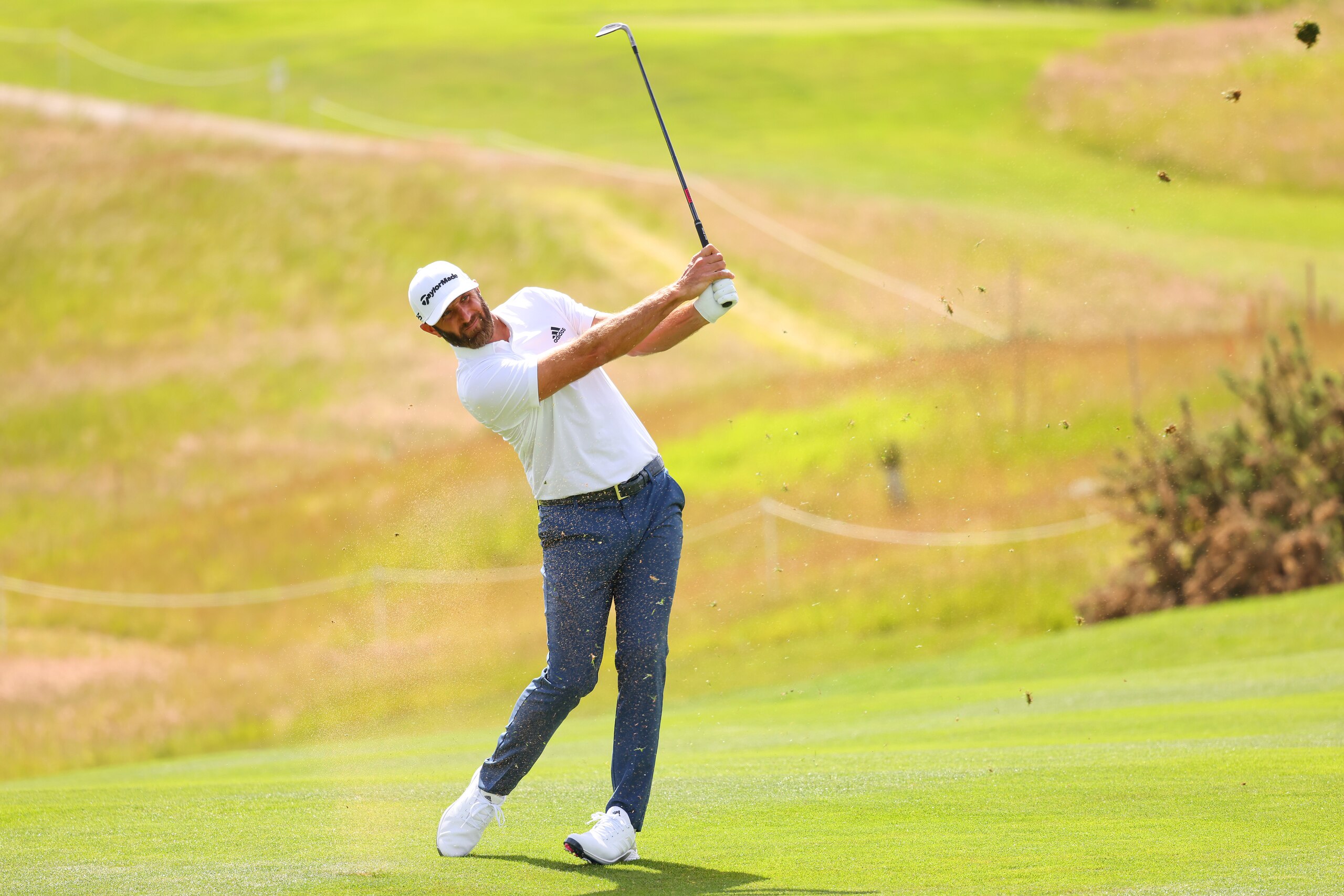 ST ALBANS, ENGLAND - JUNE 10: Dustin Johnson of 4 Aces GC plays his second shot on the eighth hole during day two of the LIV Golf Invitational - London at The Centurion Club on June 10, 2022 in St Albans, England. (Photo by Chris Trotman/LIV Golf/Getty Images)