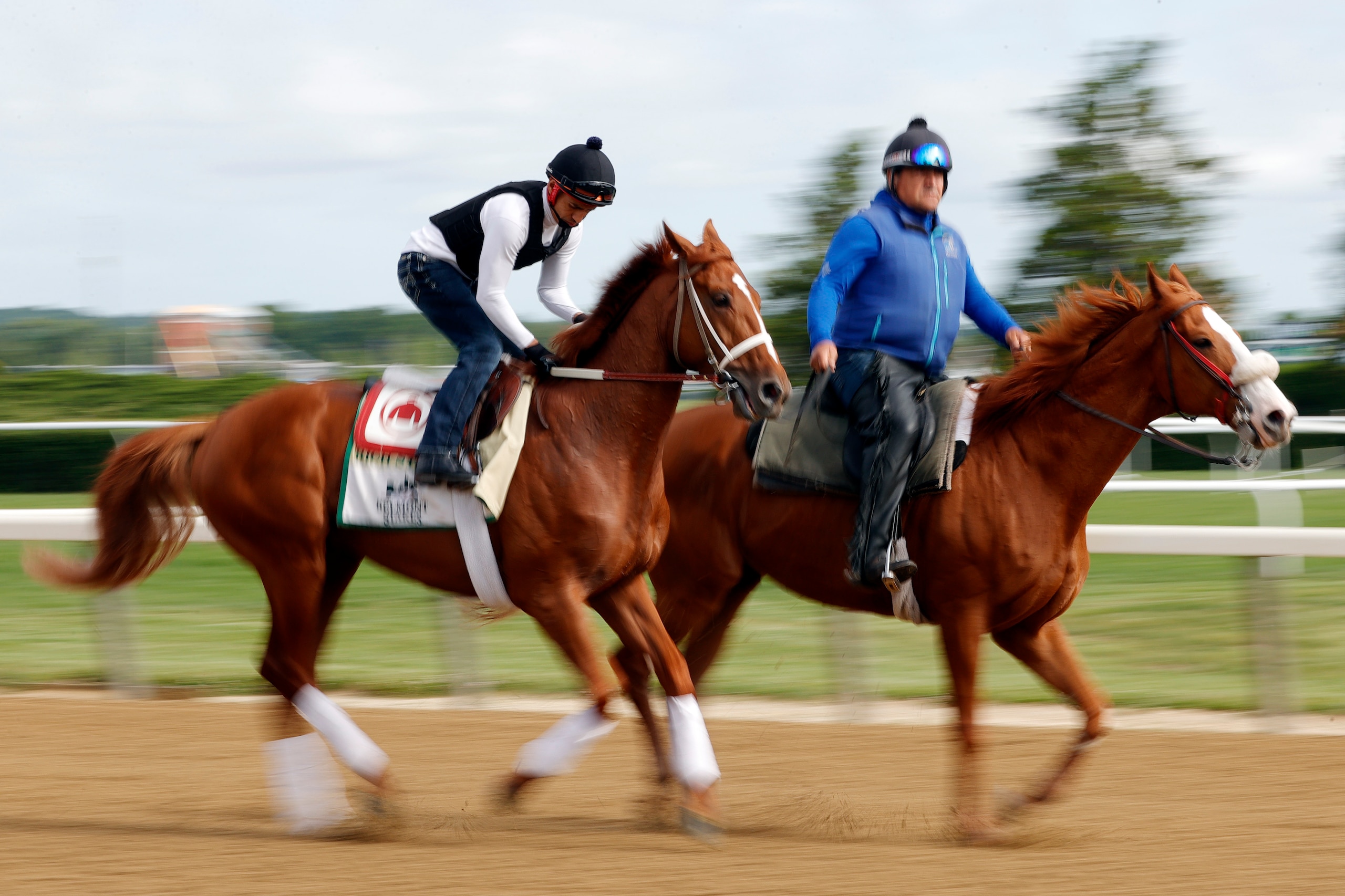 ELMONT, NEW YORK - JUNE 07:  Rich Strike and his exercise rider train on the track during a morning workout prior to the 154th running of the Belmont Stakes at Belmont Park on June 07, 2022 in Elmont, New York. (Photo by Sarah Stier/Getty Images)