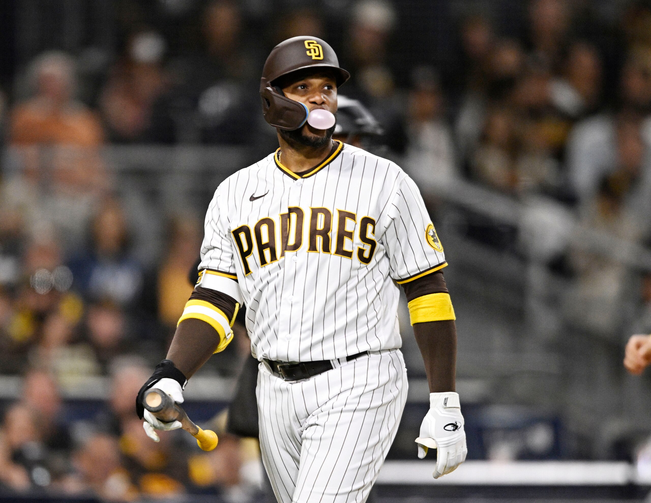SAN DIEGO, CA - MAY 27: Robinson Cano #24 of the San Diego Padres blows a bubble after striking out during the seventh inning of a baseball game against the Pittsburgh Pirates on May 27, 2022 at Petco Park in San Diego, California. (Photo by Denis Poroy/Getty Images)
