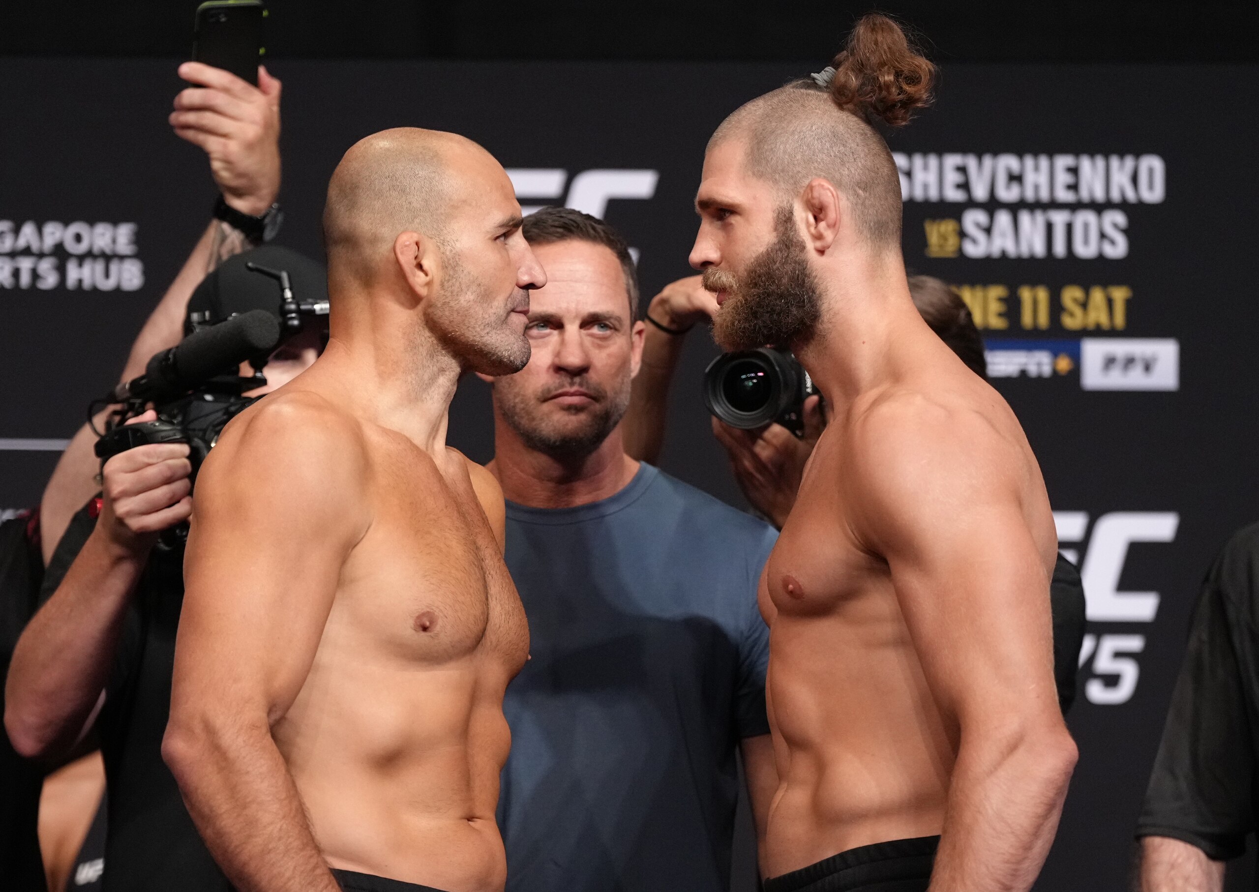 SINGAPORE, SINGAPORE - JUNE 10: (L-R) Opponents Glover Teixeira of Brazil and Jiri Prochazka of Czech Republic face off during the UFC 275 weigh-in at Singapore Indoor Stadium on June 10, 2022 in Singapore. (Photo by Jeff Bottari/Zuffa LLC)