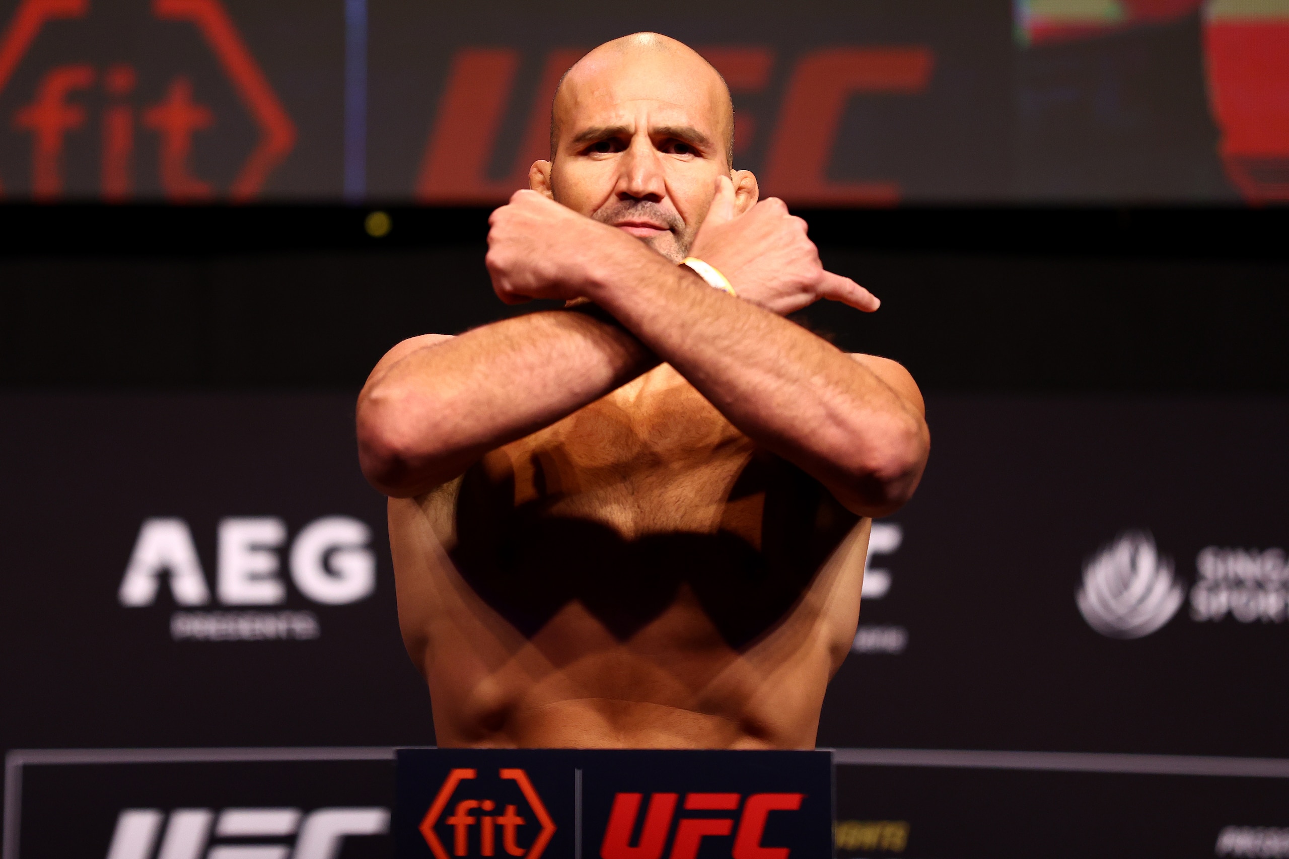 SINGAPORE, SINGAPORE - JUNE 10: UFC light heavyweight champion Glover Teixeira of Brazil poses on the scale ahead of his title defense bout against Jiri Prochazka of the Czech Republic during the UFC 275 Weigh-in at Singapore Indoor Stadium on June 10, 2022 in Singapore. (Photo by Yong Teck Lim/Getty Images)