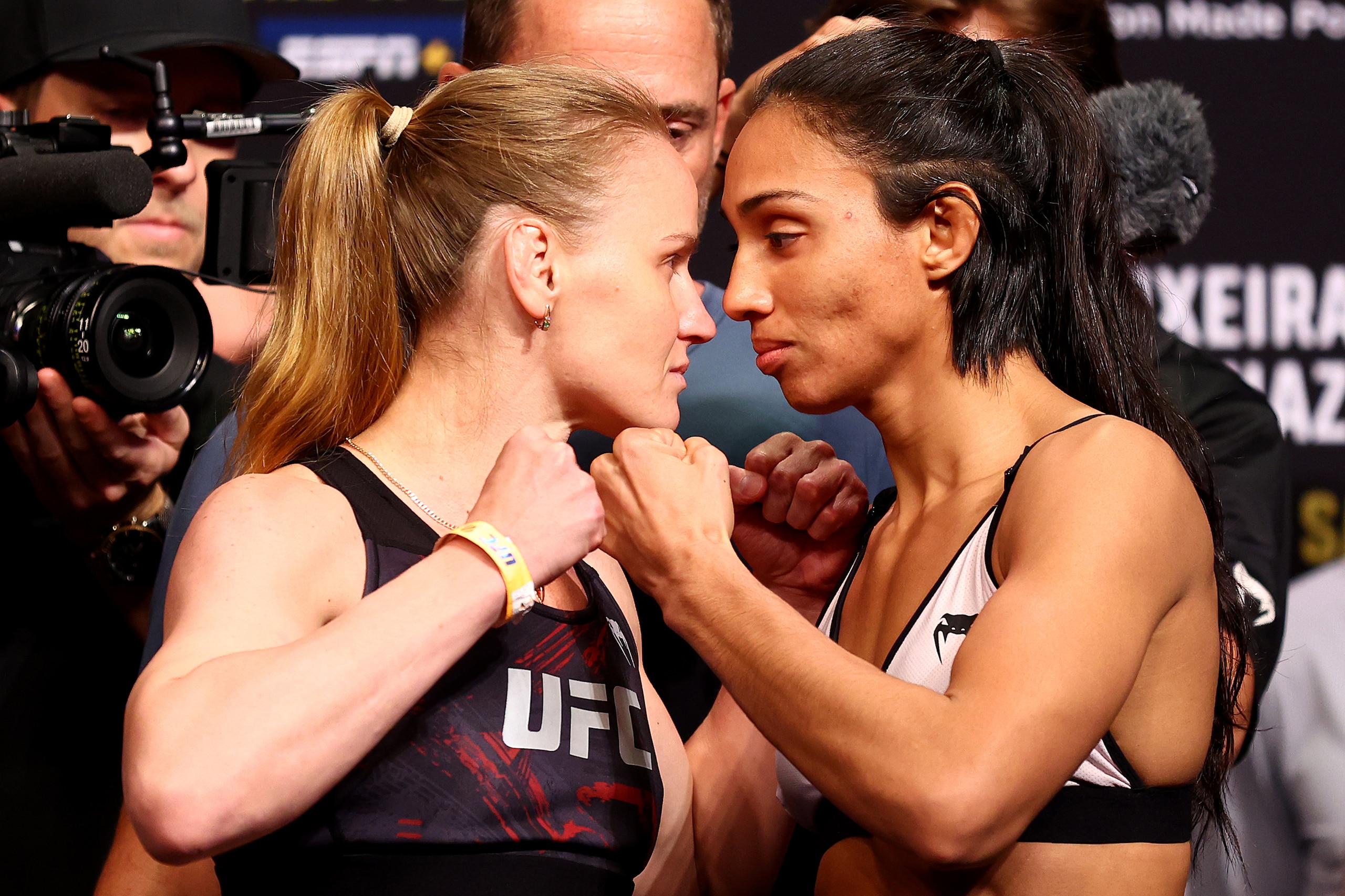 SINGAPORE, SINGAPORE - JUNE 10: UFC flyweight champion Valentina Shevchenko (L) of Kyrgyzstan and Taila Santos of Brazil face off ahead of their title bout during the UFC 275 Weigh-in at Singapore Indoor Stadium on June 10, 2022 in Singapore. (Photo by Yong Teck Lim/Getty Images)