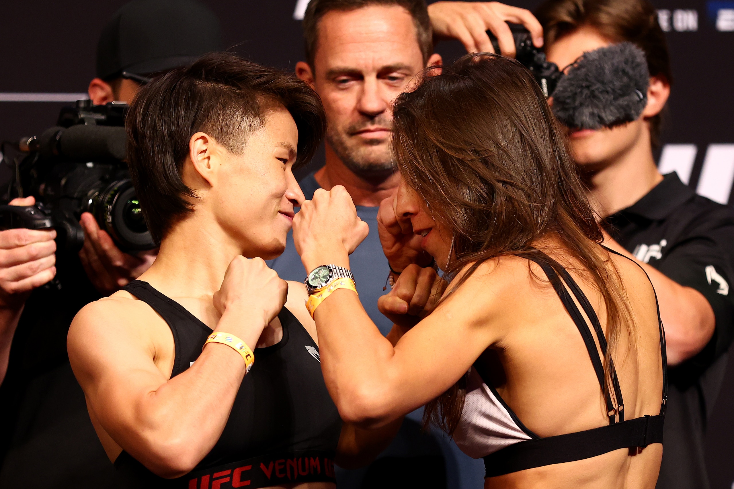 SINGAPORE, SINGAPORE - JUNE 10: Zhang Weili (L) of China and Joanna Jedrzejczyk of Poland face off ahead of their strawweight bout during the UFC 275 Weigh-in at Singapore Indoor Stadium on June 10, 2022 in Singapore. (Photo by Yong Teck Lim/Getty Images)