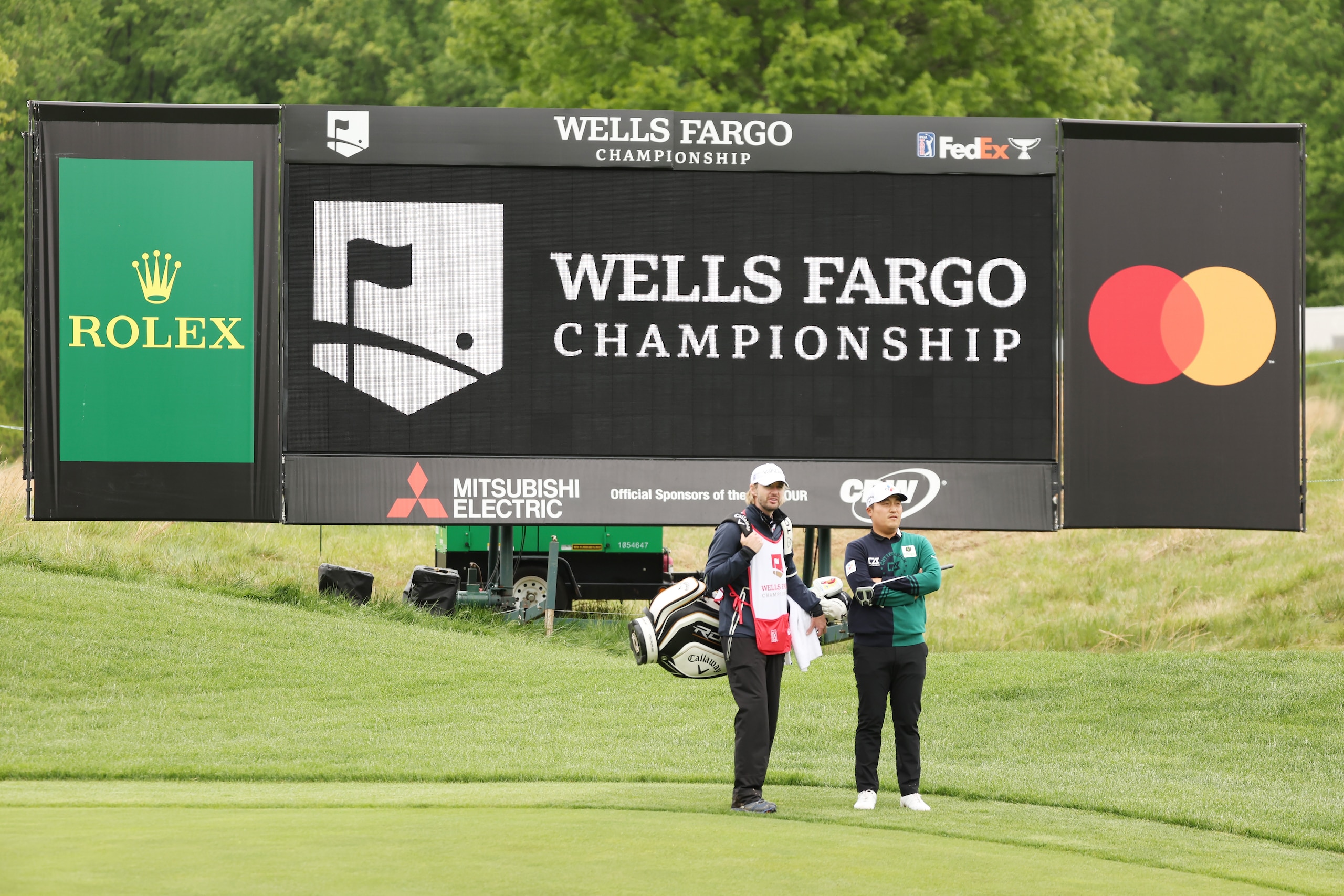 POTOMAC, MARYLAND - MAY 08: Kyoung-Hoon Lee of South Korea talks with his caddie Daniel Parratt on the seventh hole during the final round of the Wells Fargo Championship at TPC Potomac at Avenel Farm on May 08, 2022 in Potomac, Maryland. (Photo by Gregory Shamus/Getty Images)