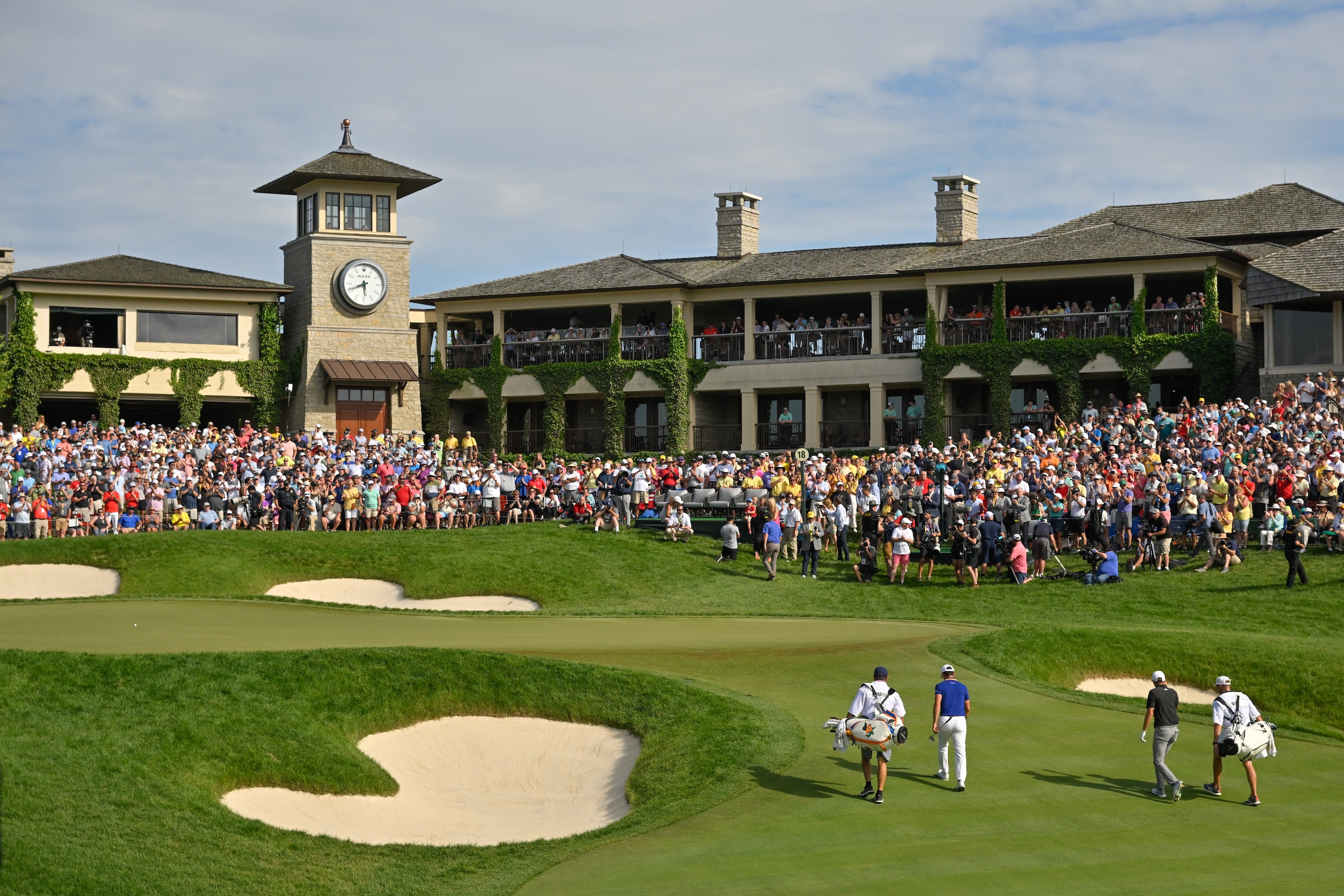 DUBLIN, OHIO - JUNE 05: Billy Horschel, Aaron Wise and their caddies walk onto the 18th green during the final round of the Memorial Tournament presented by Workday at Muirfield Village Golf Club on June 5, 2022 in Dublin, Ohio. (Photo by Ben Jared/PGA TOUR via Getty Images)