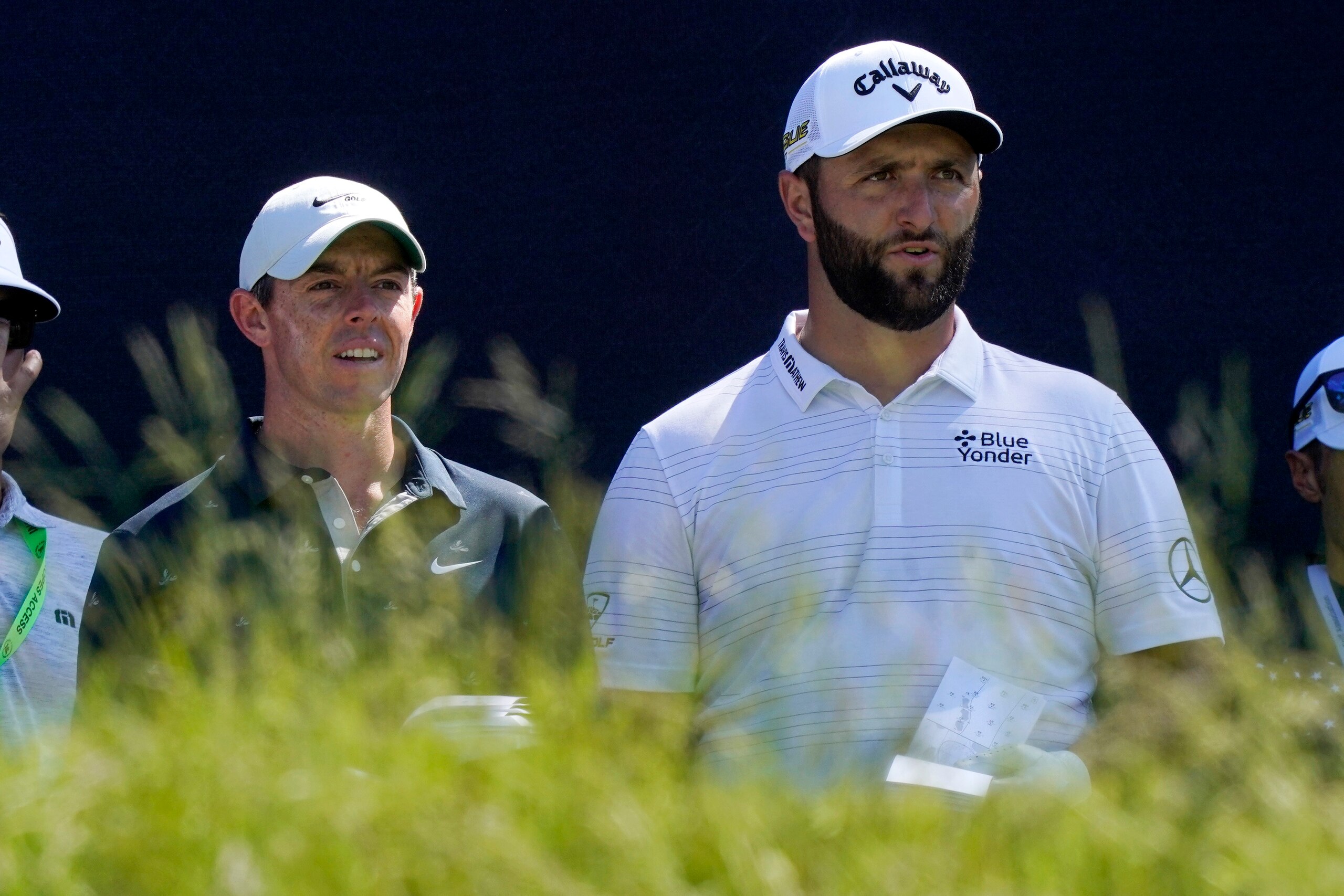 Rory McIlroy, left, of Northern Ireland, and Jon Rahm, of Spain, talk before teeing off at the fifth hole at The Country Club, Monday, June 13, 2022, in Brookline, Mass., during a practice round ahead of the U.S. Open golf tournament. (AP Photo/Robert F. Bukaty) Rory McIlroy, left, of Northern Ireland, and Jon Rahm, of Spain, talk before teeing off at the fifth hole at The Country Club, Monday, June 13, 2022, in Brookline, Mass., during a practice round ahead of the U.S. Open golf tournament. (AP Photo/Robert F. Bukaty)