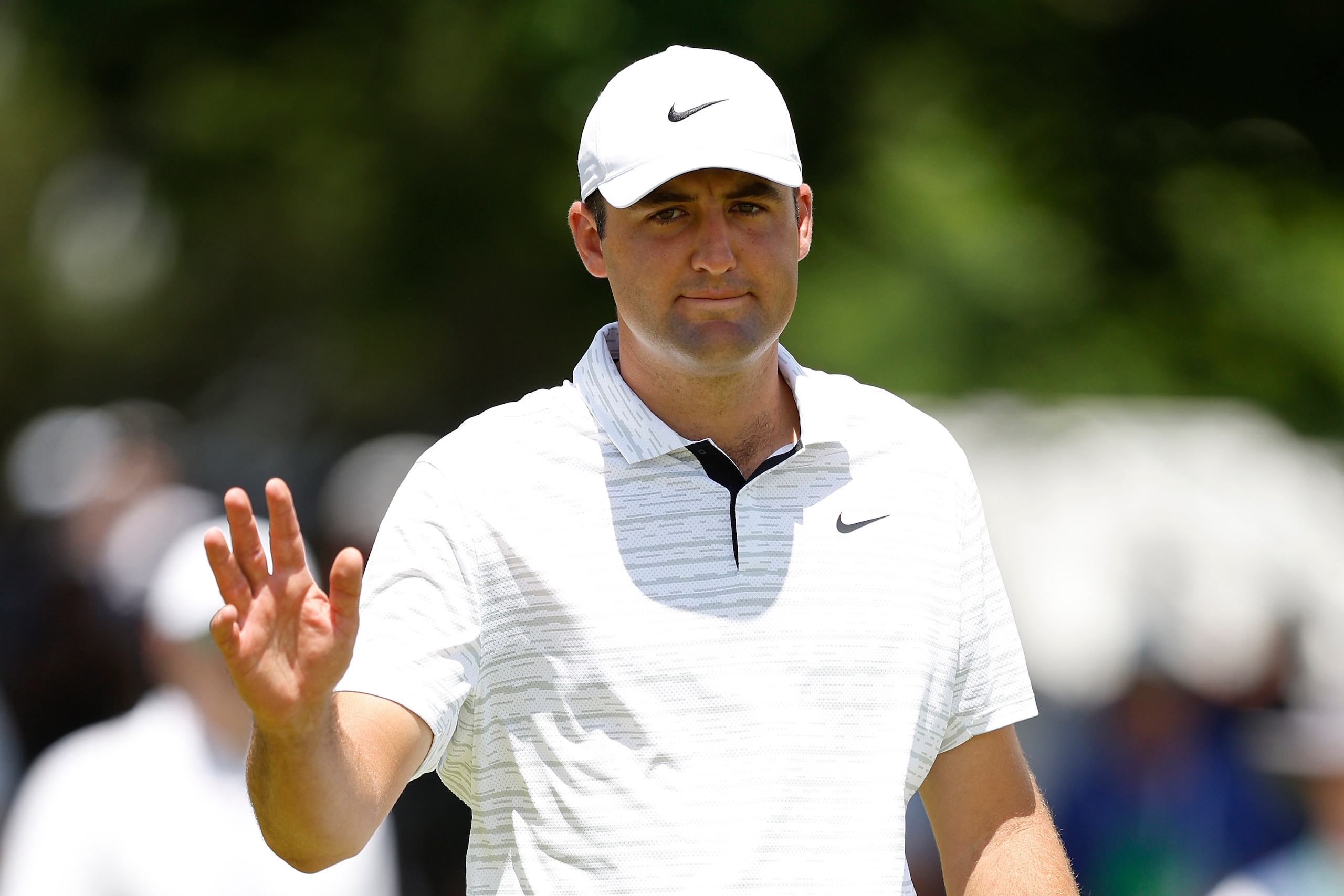 BROOKLINE, MASSACHUSETTS - JUNE 13: Scottie Scheffler of the United States waves on the second green during a practice round prior to the 2022 U.S. Open at The Country Club on June 13, 2022 in Brookline, Massachusetts. (Photo by Cliff Hawkins/Getty Images) BROOKLINE, MASSACHUSETTS - JUNE 13: Scottie Scheffler of the United States waves on the second green during a practice round prior to the 2022 U.S. Open at The Country Club on June 13, 2022 in Brookline, Massachusetts. (Photo by Cliff Hawkins/Getty Images)