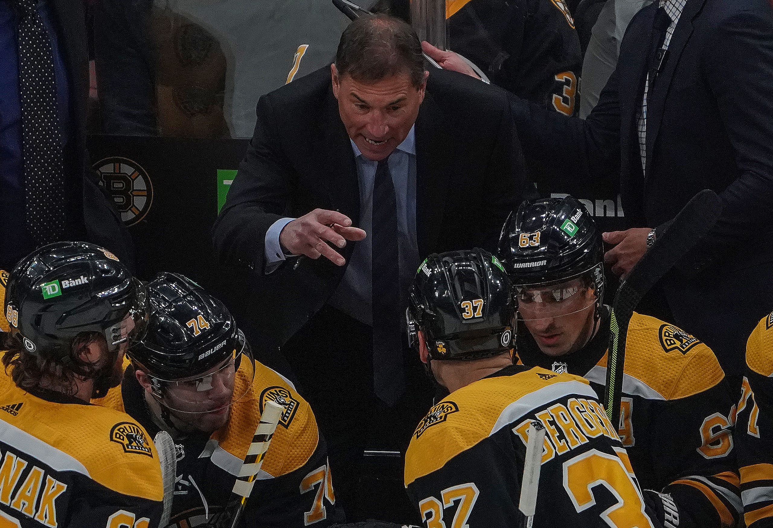 Boston - April 23: Boston Bruins head coach Bruce Cassidy  talks to his players during a break in the second period.  The Boston Bruins host the New York Rangers in a Garden matinee in Boston, MA on April 23, 2022. (Photo by Barry Chin/The Boston Globe via Getty Images)