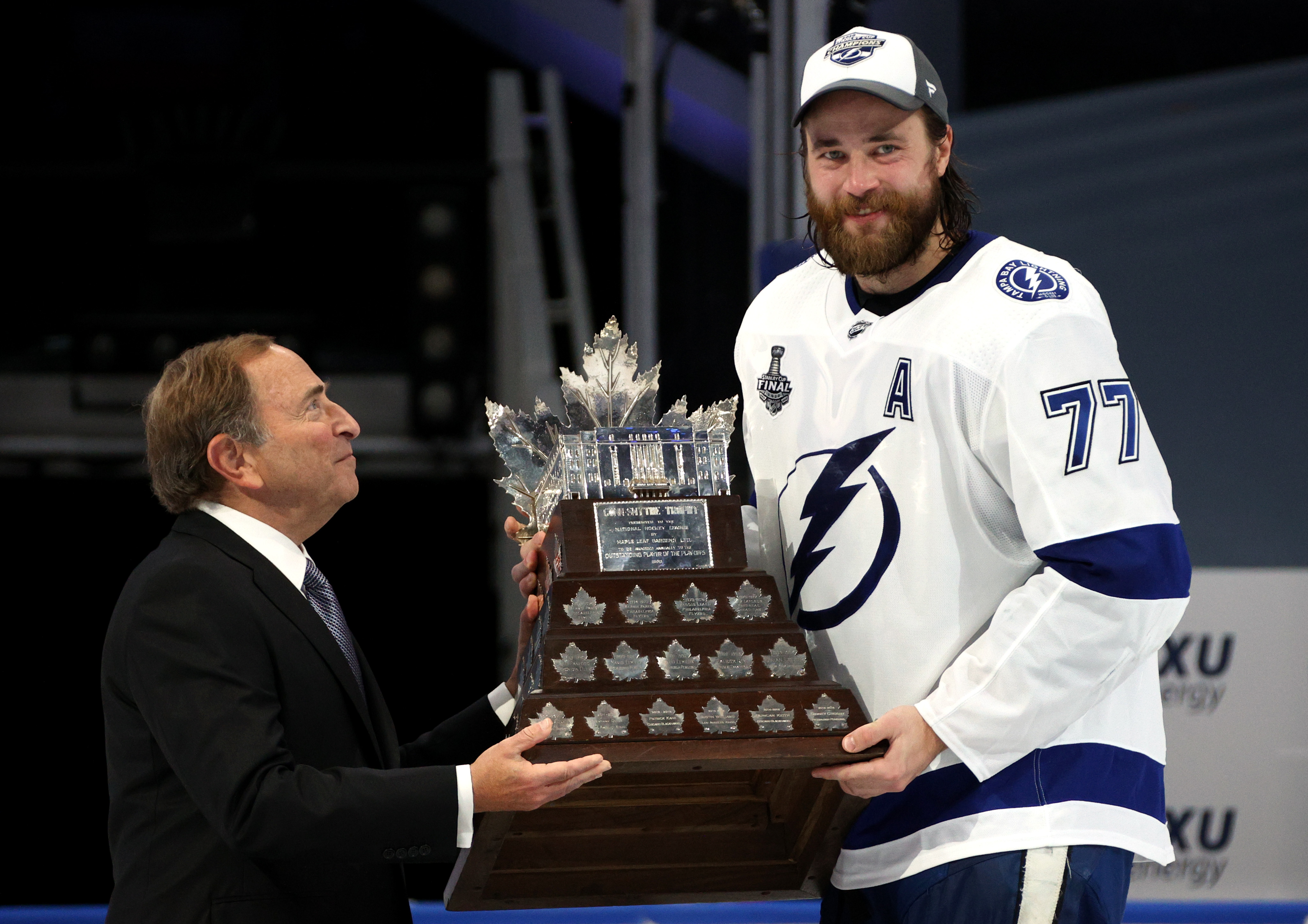 EDMONTON, ALBERTA - SEPTEMBER 28: NHL Commissioner Gary Bettman presents the Conn Smythe Trophy to Victor Hedman #77 of the Tampa Bay Lightning after Game Six of the NHL Stanley Cup Final between the Tampa Bay Lightning and the Dallas Stars at Rogers Place on September 28, 2020 in Edmonton, Alberta, Canada. (Photo by Dave Sandford/NHLI via Getty Images)