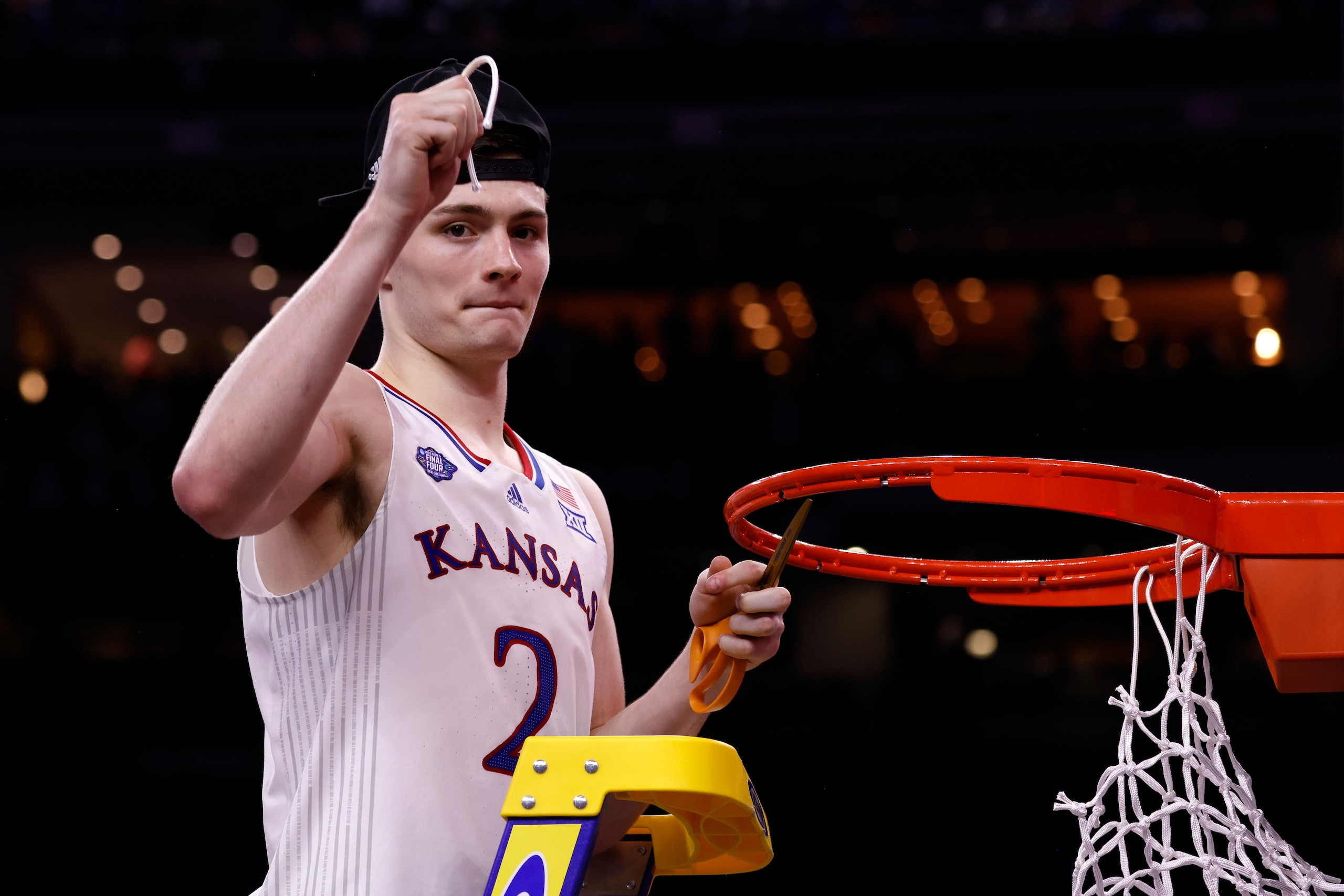 NEW ORLEANS, LA - APRIL 04: Christian Braun #2 of the Kansas Jayhawks cuts the net following their victory against the North Carolina Tar Heels during the 2022 NCAA Men's Basketball Tournament Final Four Championship at Caesars Superdome on April 4, 2022 in New Orleans, Louisiana. (Photo by Lance King/Getty Images)