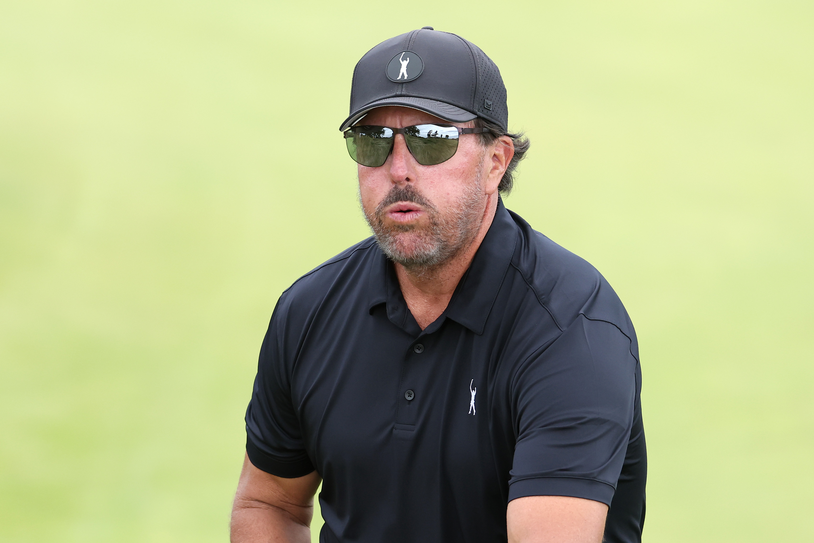 BROOKLINE, MASSACHUSETTS - JUNE 16: Phil Mickelson of the United States looks on as he walks off the seventh green during round one of the 122nd U.S. Open Championship at The Country Club on June 16, 2022 in Brookline, Massachusetts. (Photo by Warren Little/Getty Images)