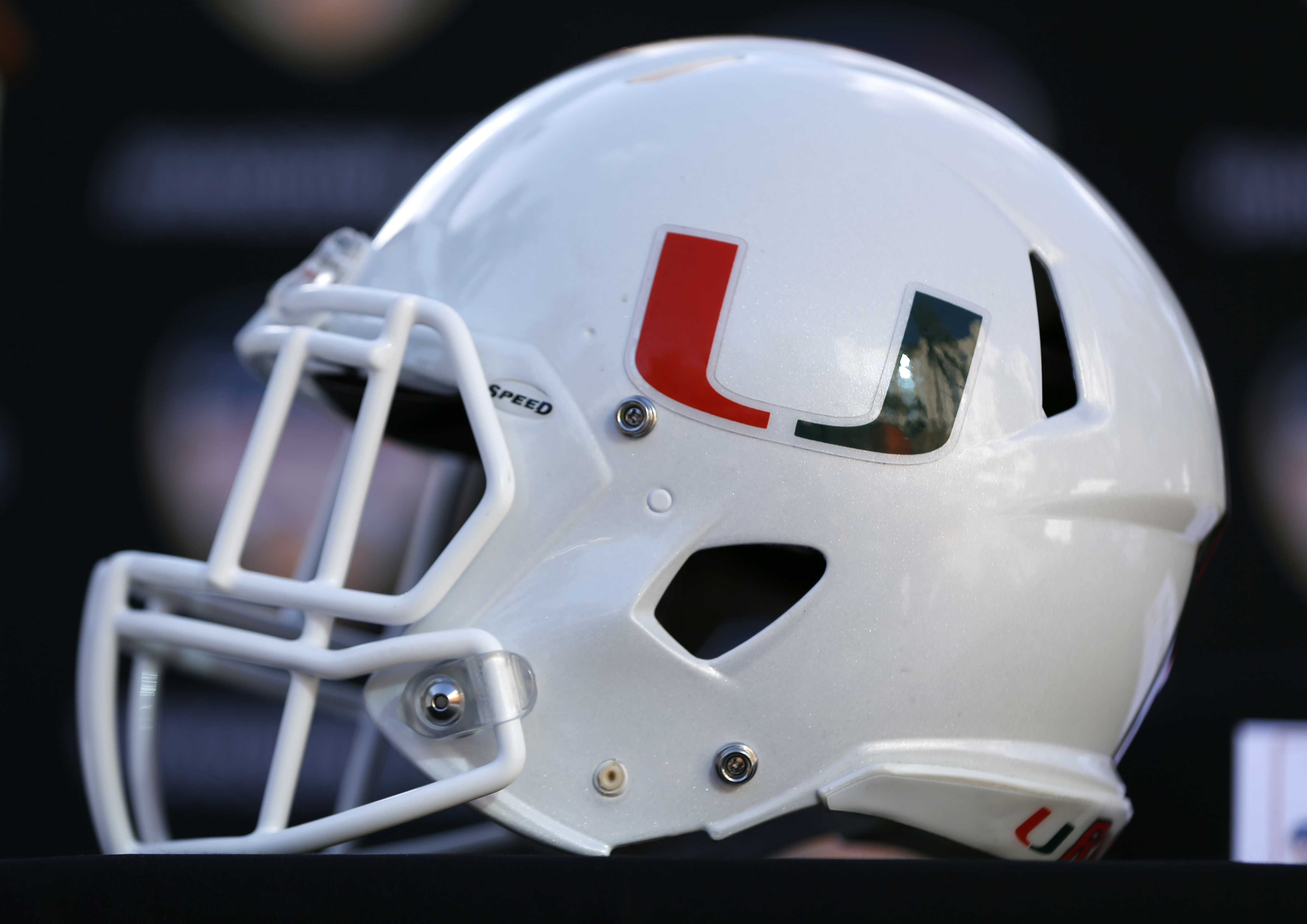 A Miami football helmet is shown before a news conference, Wednesday, Dec. 6, 2017 in Hollywood, Fla. Wisconsin will play Miami Dec. 30 in the Orange Bowl at Hard Rock Stadium in Miami Gardens, Fla. (AP Photo/Wilfredo Lee)