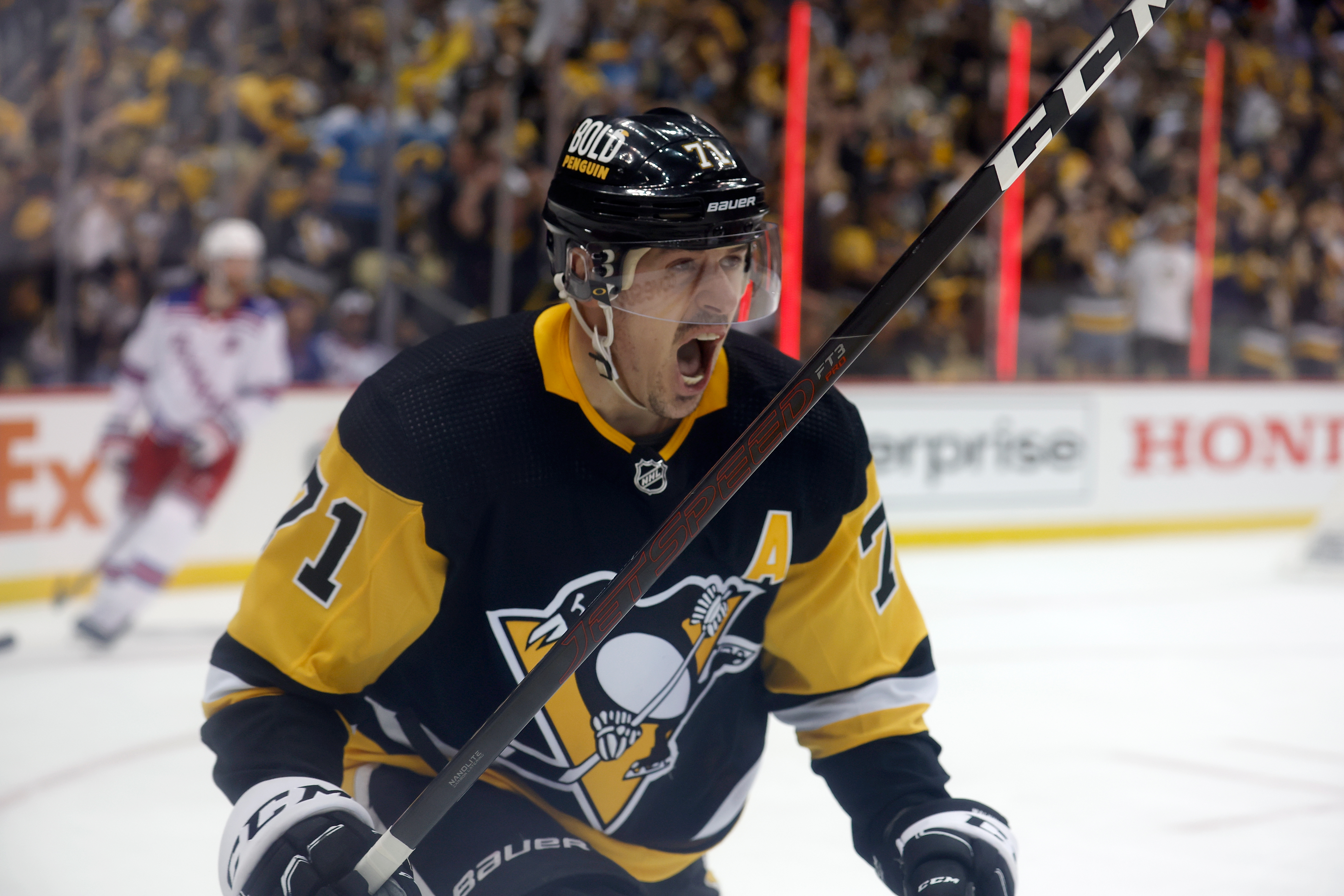 Pittsburgh Penguins Evgeni Malkin watches the replay of his goal