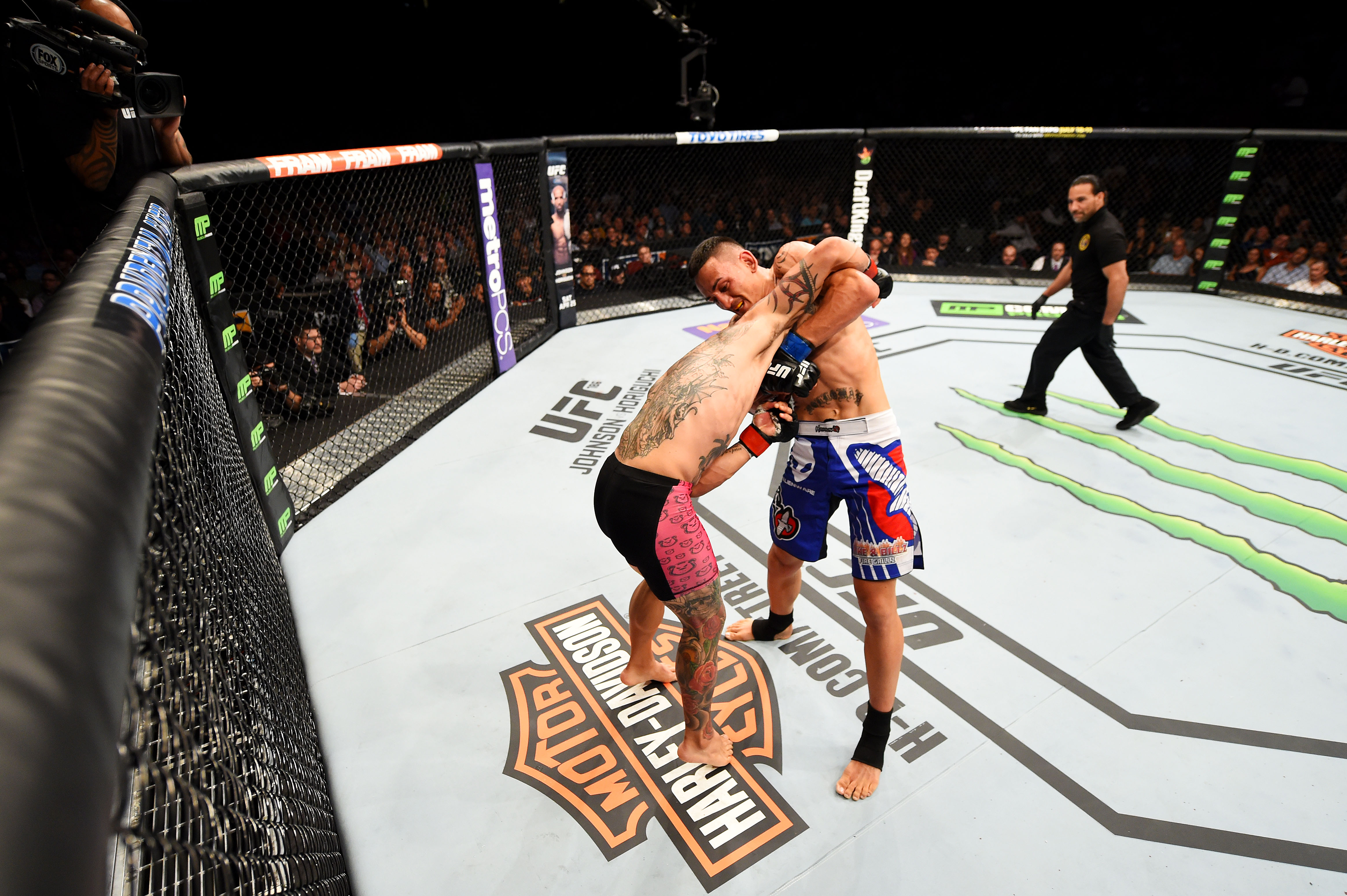 NEWARK, NJ - APRIL 18: Cub Swanson and Max Holloway grapple in their featherweight bout during the UFC Fight Night event at Prudential Center on April 18, 2015 in Newark, New Jersey. (Photo by Josh Hedges/Zuffa LLC/Zuffa LLC via Getty Images)