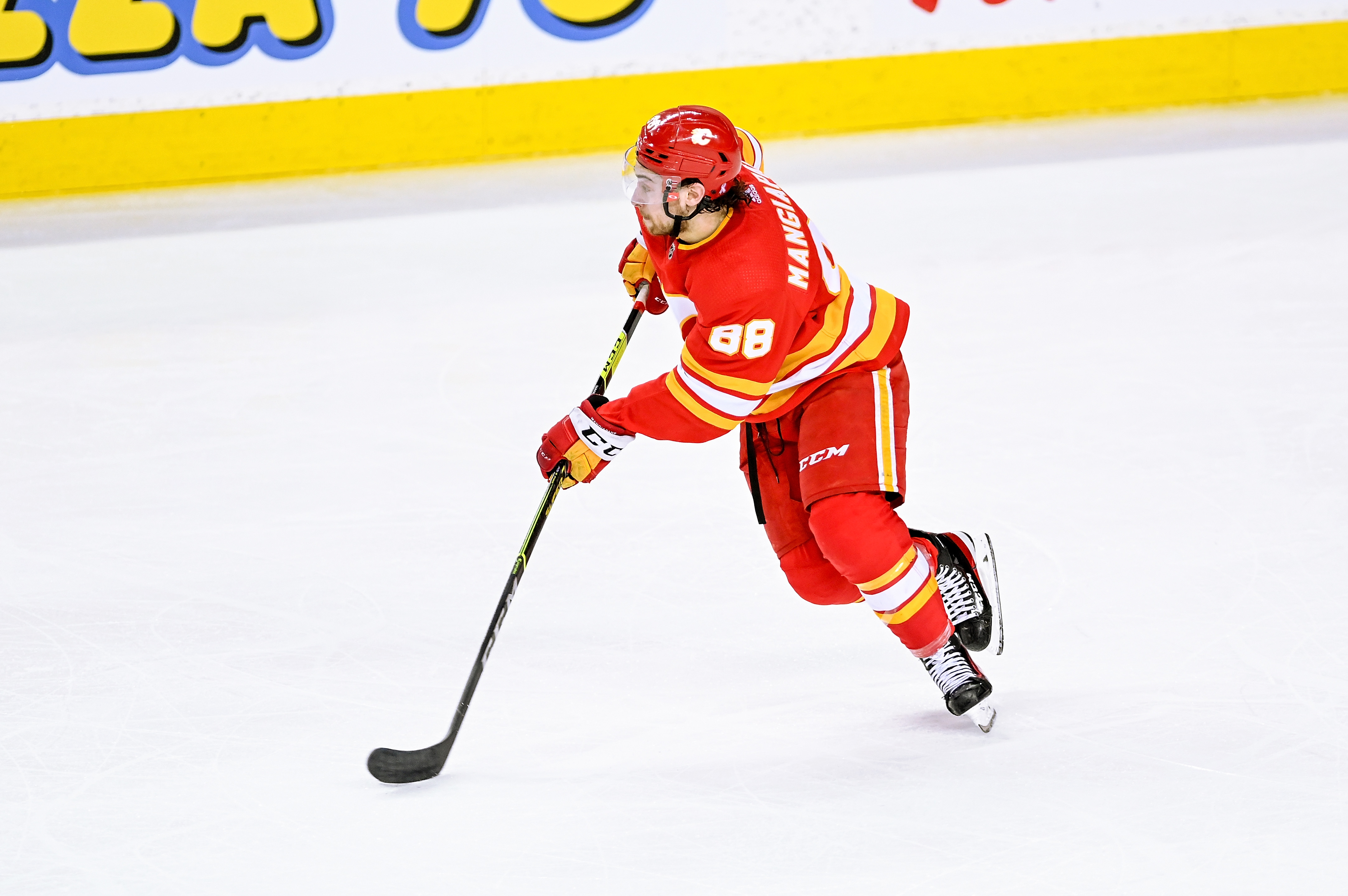 CALGARY, AB - MAY 26: Calgary Flames Left Wing Andrew Mangiapane (88) skates with the puck during the second period of game 5 of the second round of the NHL Stanley Cup Playoffs between the Calgary Flames and the Edmonton Oilers on May 26, 2022, at the Scotiabank Saddledome in Calgary, AB. (Photo by Brett Holmes/Icon Sportswire via Getty Images)