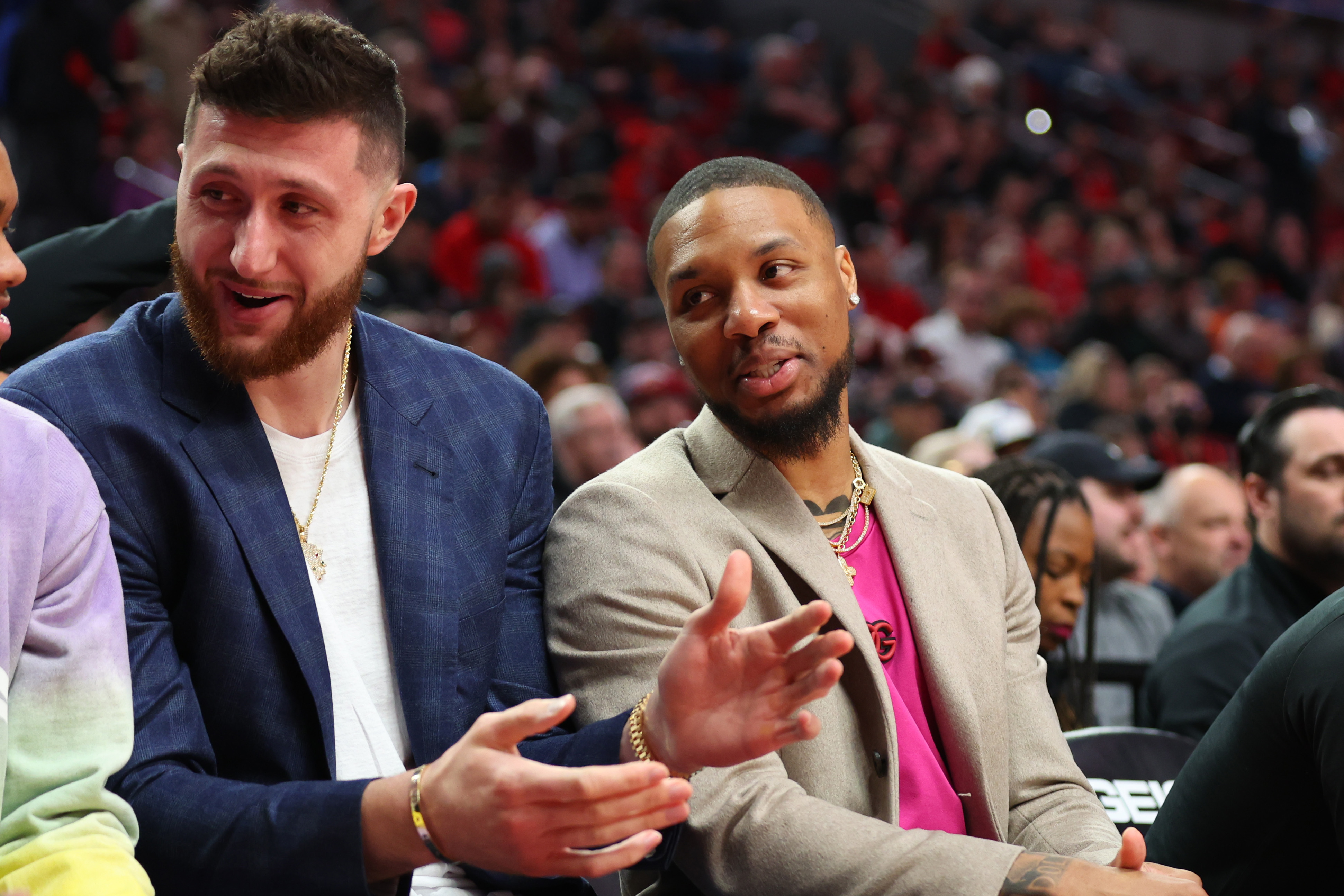 PORTLAND, OREGON - APRIL 10: Jusuf Nurkic #27 and Damian Lillard #0 of the Portland Trail Blazers react during the first quarter against the Utah Jazz at Moda Center on April 10, 2022 in Portland, Oregon. NOTE TO USER: User expressly acknowledges and agrees that, by downloading and or using this photograph, User is consenting to the terms and conditions of the Getty Images License Agreement. (Photo by Abbie Parr/Getty Images)