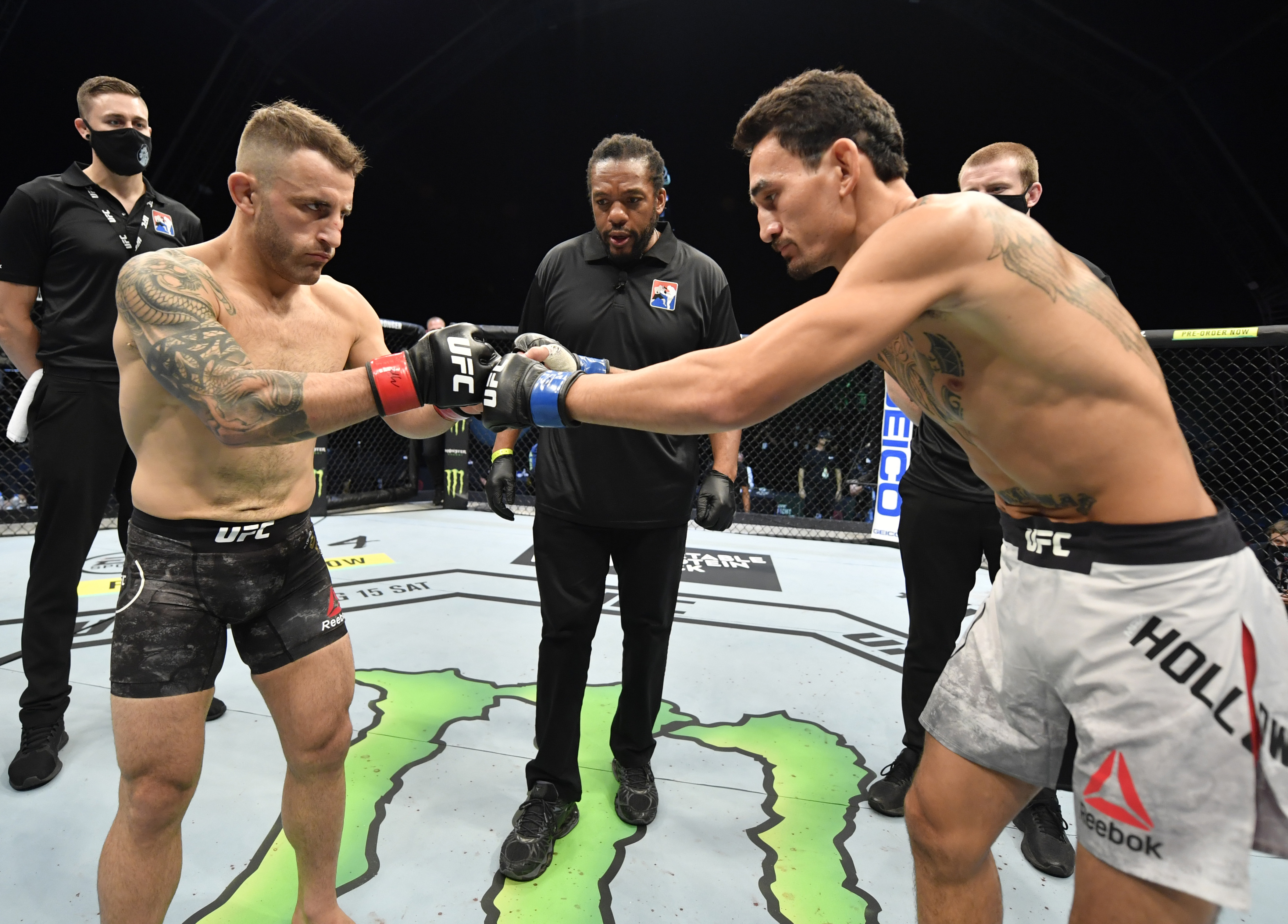 ABU DHABI, UNITED ARAB EMIRATES - JULY 12: (L-R) Opponents Alexander Volkanovski of Australia and Max Holloway face off prior to their UFC featherweight championship fight during the UFC 251 event at Flash Forum on UFC Fight Island on July 12, 2020 on Yas Island, Abu Dhabi, United Arab Emirates. (Photo by Jeff Bottari/Zuffa LLC)