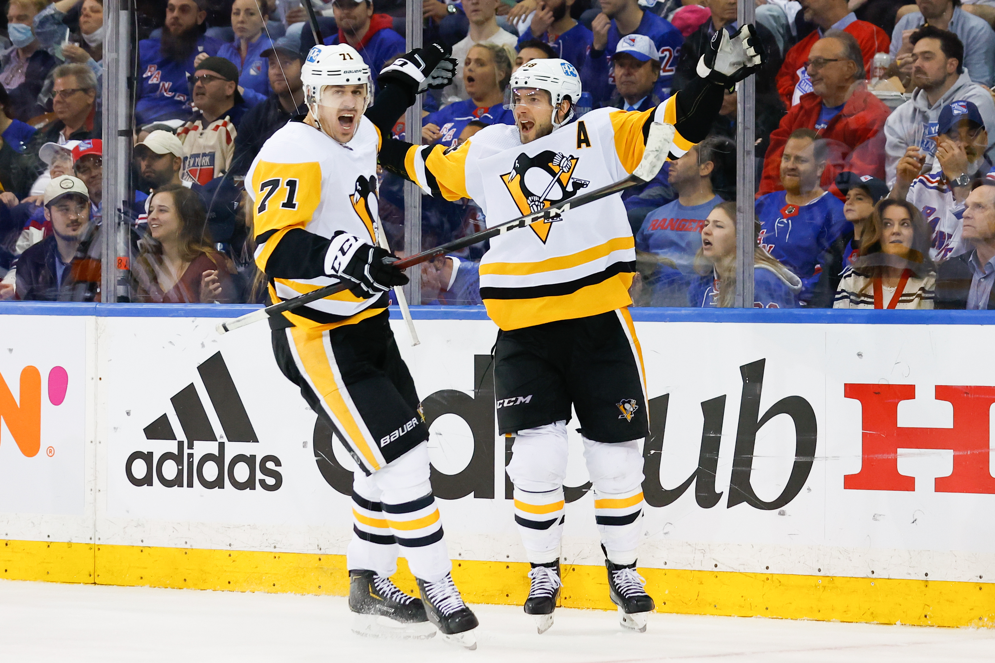 NEW YORK, NY - MAY 11:  Pittsburgh Penguins defenseman Kris Letang (58) celebrates with teammate Pittsburgh Penguins center Evgeni Malkin (71) after scoring during  game 5 of round 1 of the Stanley Cup Playoffs between the New York Rangers and the Pittsburgh Penguins on May 11, 2022 at Madison Square Garden in New York City, New York (Photo by Rich Graessle/Icon Sportswire via Getty Images)
