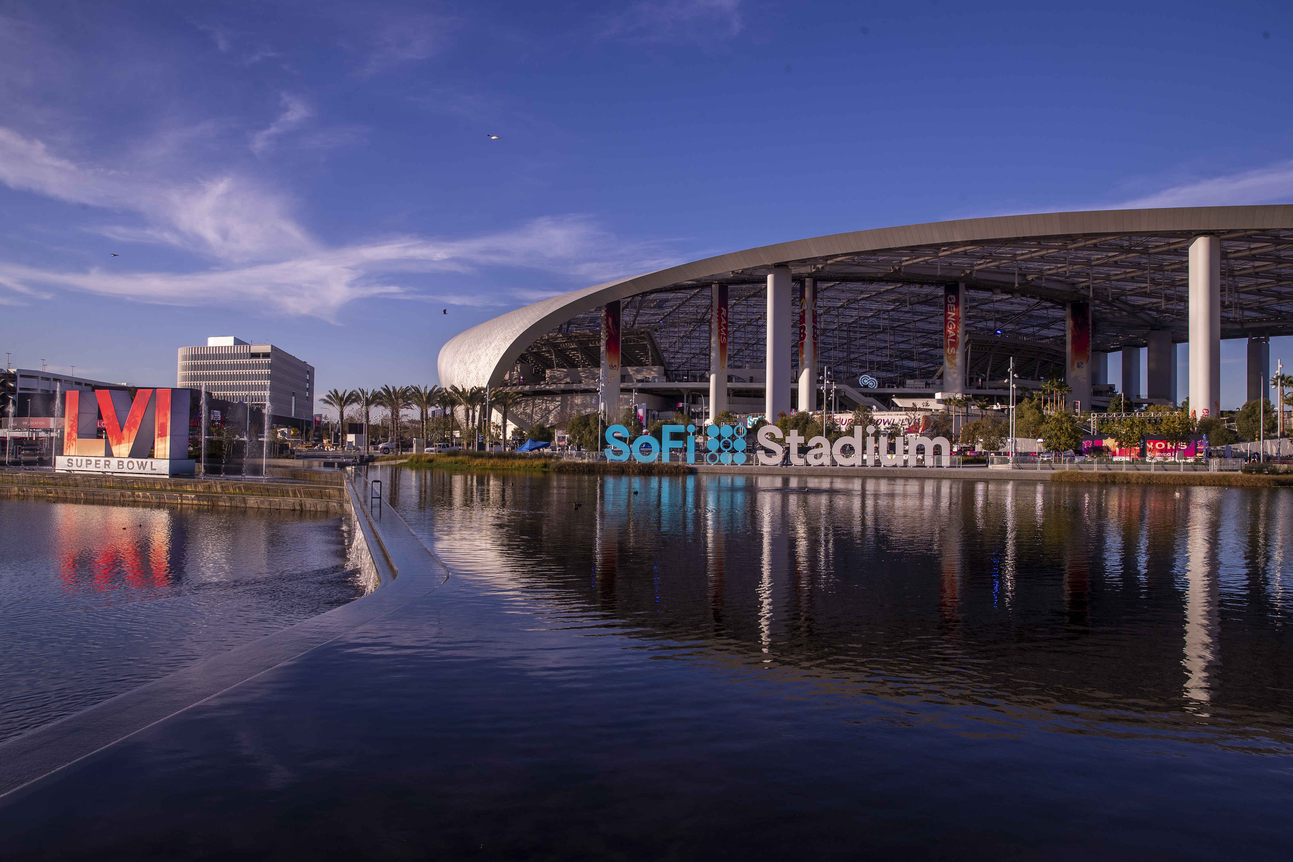 Los Angeles, CA - February 09: Workers make last minute preparations for the Super Bowl as viewed from the lake at SoFi Stadium in Los Angeles Wednesday, Feb. 9, 2022. (Allen J. Schaben / Los Angeles Times via Getty Images)