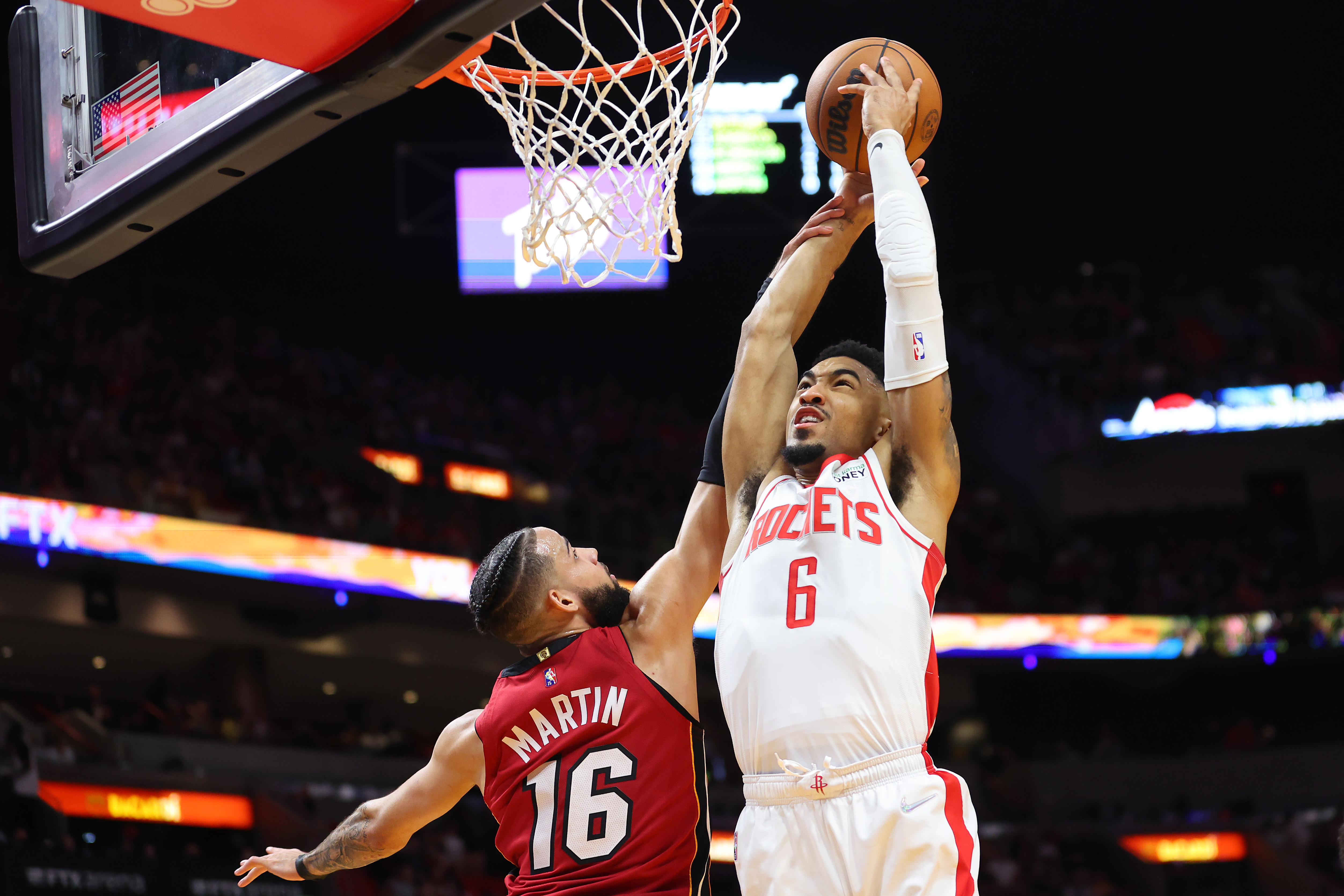 MIAMI, FLORIDA - MARCH 07: Kenyon Martin Jr. #6 of the Houston Rockets dunks against Caleb Martin #16 of the Miami Heat during the first half at FTX Arena on March 07, 2022 in Miami, Florida. NOTE TO USER: User expressly acknowledges and agrees that, by downloading and or using this photograph, User is consenting to the terms and conditions of the Getty Images License Agreement. (Photo by Michael Reaves/Getty Images) MIAMI, FLORIDA - MARCH 07: Kenyon Martin Jr. #6 of the Houston Rockets dunks against Caleb Martin #16 of the Miami Heat during the first half at FTX Arena on March 07, 2022 in Miami, Florida. NOTE TO USER: User expressly acknowledges and agrees that, by downloading and or using this photograph, User is consenting to the terms and conditions of the Getty Images License Agreement. (Photo by Michael Reaves/Getty Images)