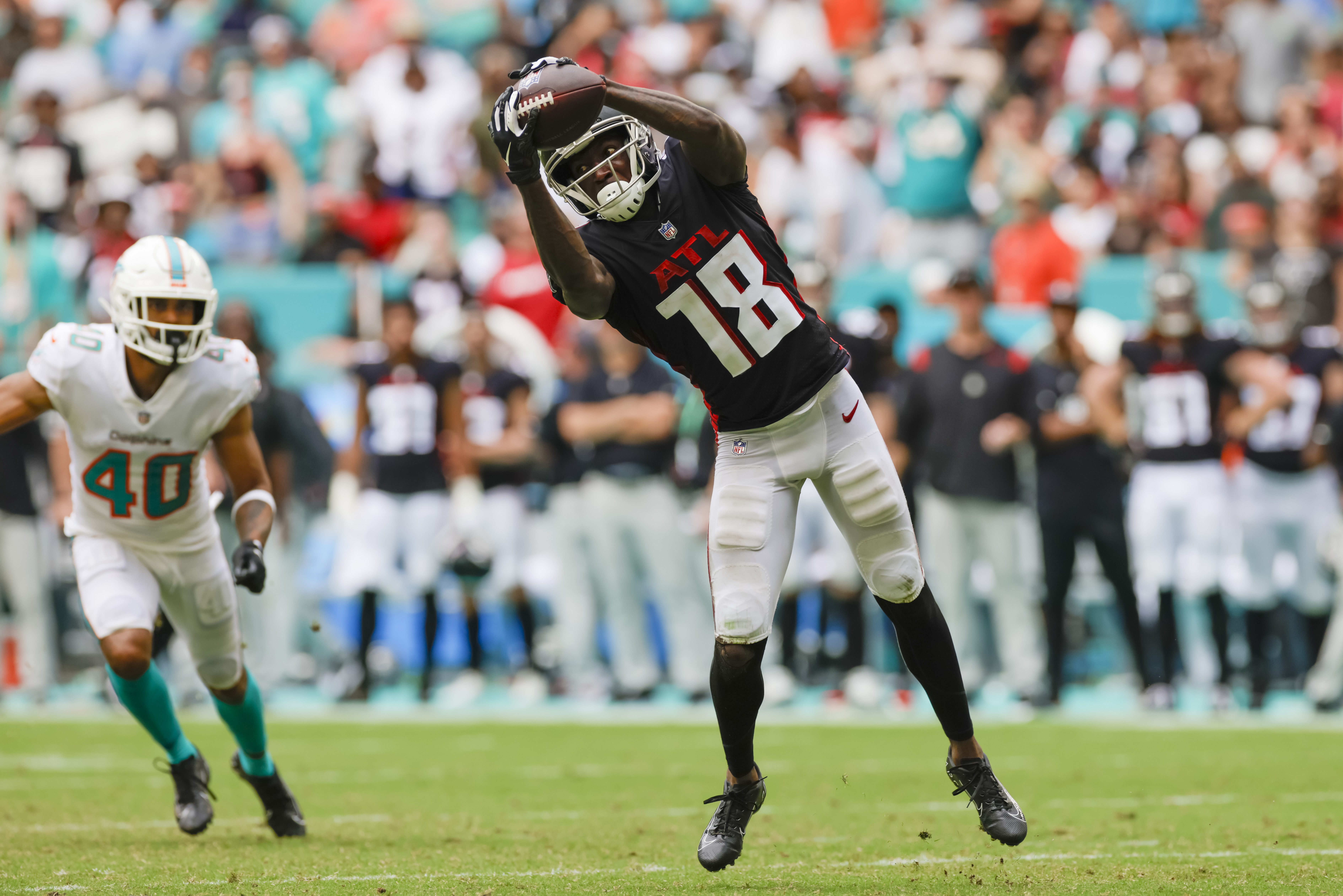 Atlanta Falcons tight end Hayden Hurst (81) leaps past Philadelphia Eagles  free safety Avonte Maddox (29)