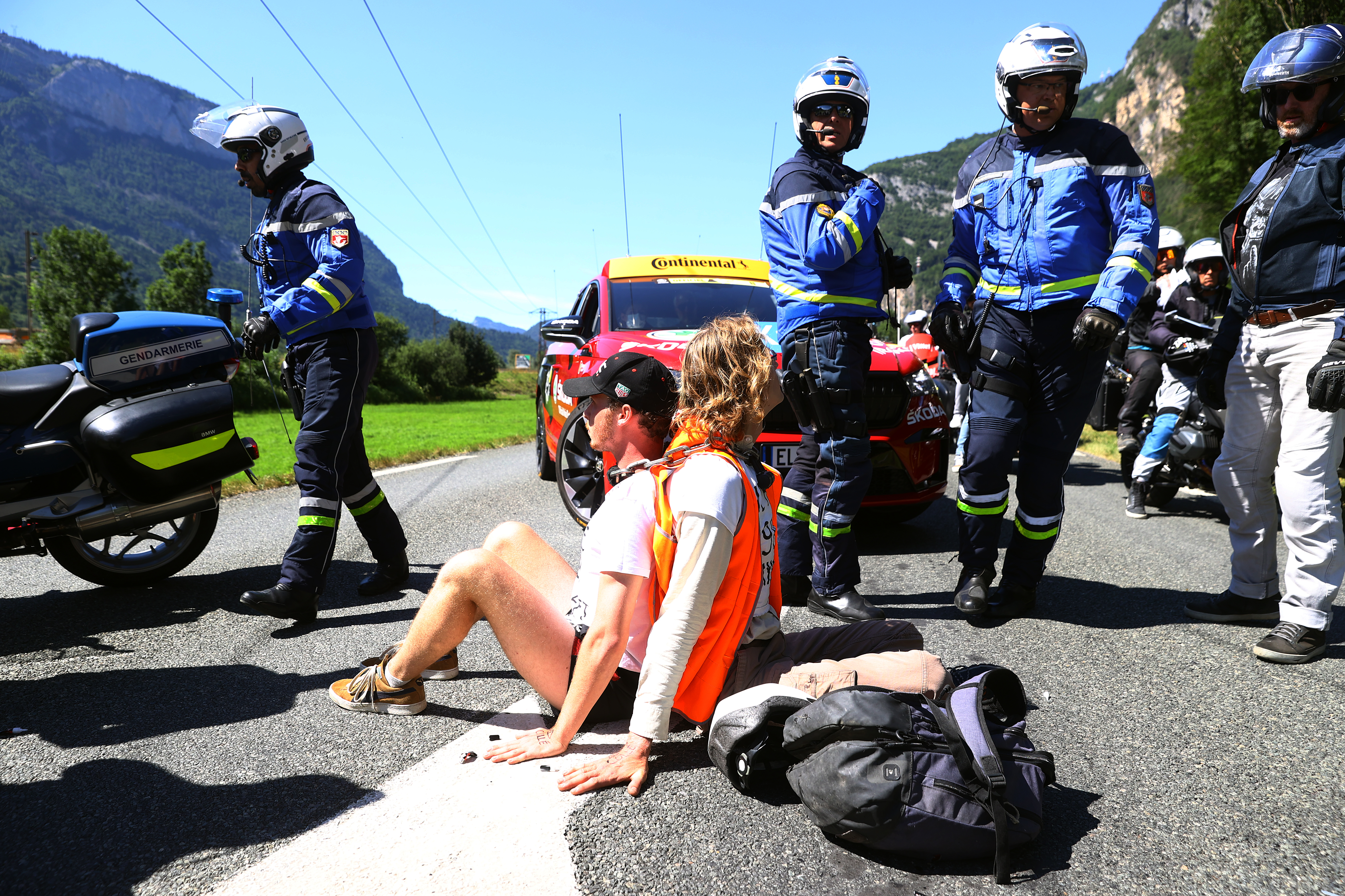 MEGEVE, FRANCE - JULY 12: Protesters in defending "Mont Blanc environment" block the route during the 109th Tour de France 2022, Stage 10 a 148,1km stage from Morzine to Megève 1435m / #TDF2022 / #WorldTour / on July 12, 2022 in Megeve, France. (Photo by Michael Steele/Getty Images)
