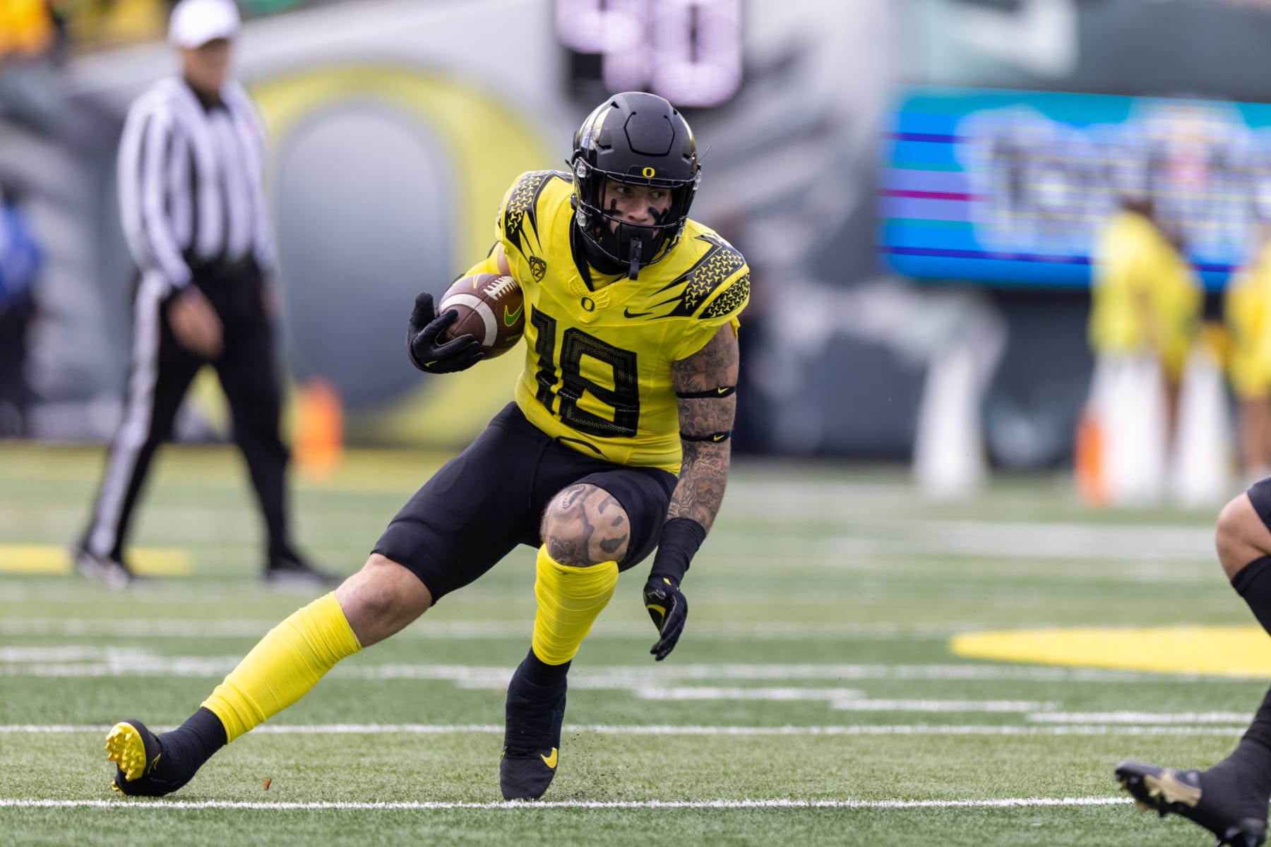 EUGENE, OR - OCTOBER 30: Spencer Webb (18) of the Oregon Ducks runs with the ball against the Colorado Buffaloes at Autzen Stadium on October 30, 2021 in Eugene, Oregon. (Photo by Tom Hauck/Getty Images) EUGENE, OR - OCTOBER 30: Spencer Webb (18) of the Oregon Ducks runs with the ball against the Colorado Buffaloes at Autzen Stadium on October 30, 2021 in Eugene, Oregon. (Photo by Tom Hauck/Getty Images)