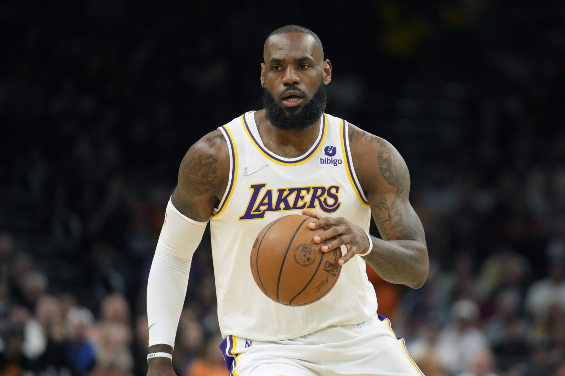 FILE -Los Angeles Lakers forward LeBron James (6) during the first half of an NBA basketball game against the Phoenix Suns, Sunday, Jan. 13, 2022, in Phoenix. LeBron James and Naomi Osaka are becoming teammates in the entertainment world. Tennis star Osaka and her agent and business partner, Stuart Duguid, are forming a media company called Hana Kuma in partnership with The SpringHill Company, which was created by NBA star James and Maverick Carter, Tuesday, June 21, 2022. (AP Photo/Rick Scuteri, File)