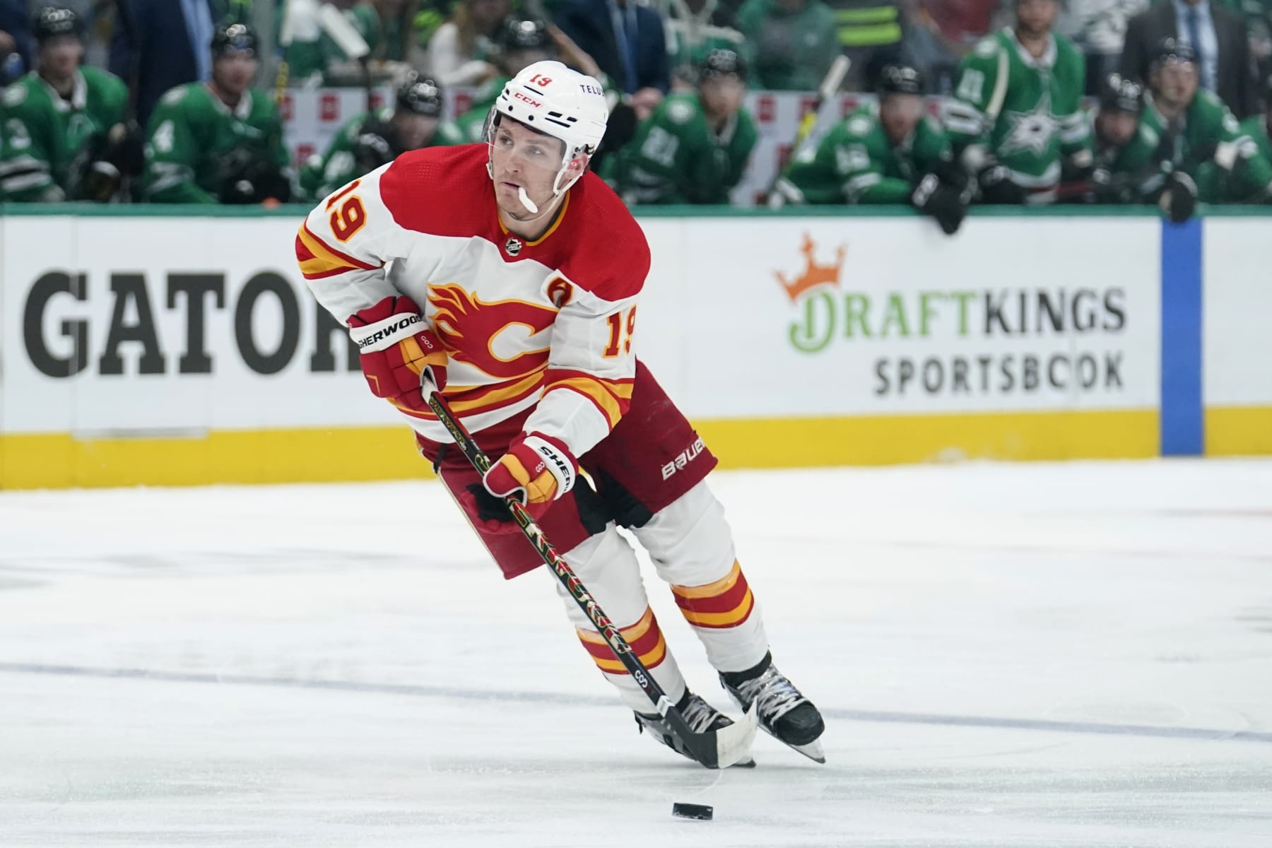 Calgary Flames left wing Matthew Tkachu controls the puck during Game 3 of an NHL hockey Stanley Cup first-round playoff series against the Dallas Stars, Sunday, May 8, 2022, in Dallas. (AP Photo/Tony Gutierrez)