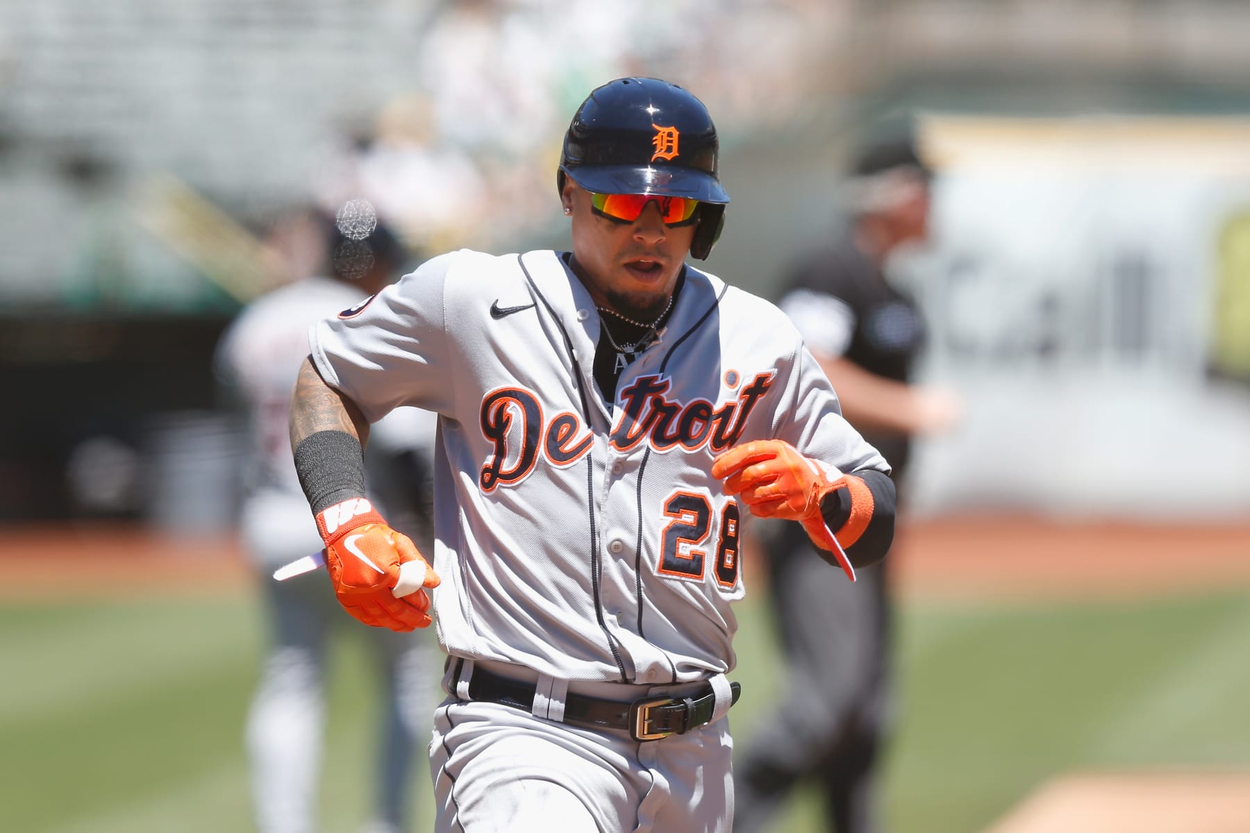 OAKLAND, CALIFORNIA - JULY 21: Javier Baez #28 of the Detroit Tigers crosses home plate to score on a double by Robbie Grossman in the top of the third inning during game one of a doubleheader at RingCentral Coliseum on July 21, 2022 in Oakland, California. (Photo by Lachlan Cunningham/Getty Images)