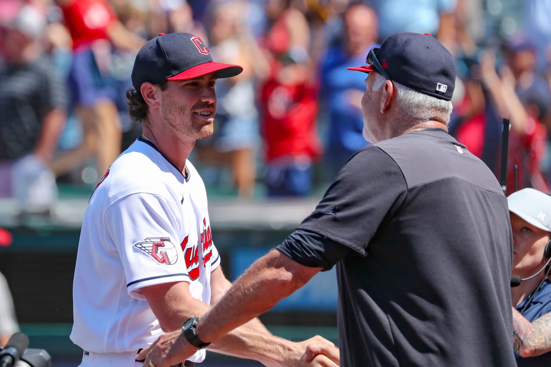 CLEVELAND, OH - JULY 12: Cleveland Guardians starting pitcher Shane Bieber (57) is congratulated by Cleveland Guardians pitching coach Carl Willis (51) following game 1 of the Major League doubleheader between the Chicago White Sox and Cleveland Guardinas on July 12, 2022, at Progressive Field in Cleveland, OH. (Photo by Frank Jansky/Icon Sportswire via Getty Images)
