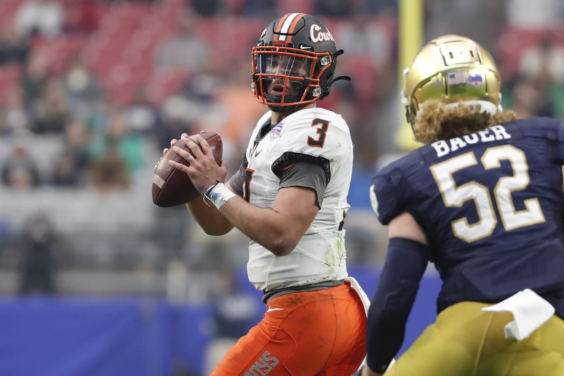 GLENDALE, ARIZONA - JANUARY 01: Quarterback Spencer Sanders #3 of the Oklahoma State Cowboys passes during the second half of the PlayStation Fiesta Bowl against the Notre Dame Fighting Irish at State Farm Stadium on January 01, 2022 in Glendale, Arizona. The Cowboys defeated the Fighting Irish 37-35. (Photo by Chris Coduto/Getty Images)