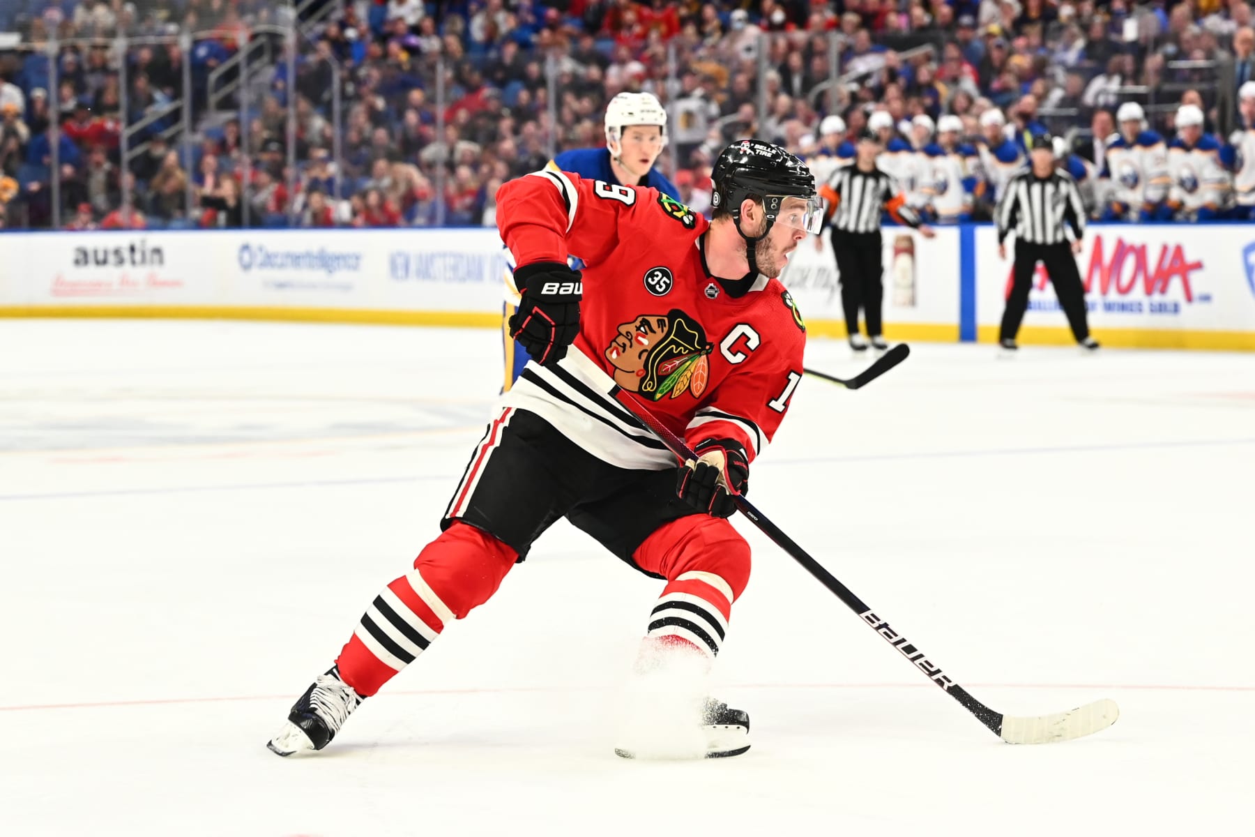 BUFFALO, NY - APRIL 29: Jonathan Toews #19 of the Chicago Blackhawks controls the puck against the Buffalo Sabres during an NHL game on April 29, 2022 at KeyBank Center in Buffalo, New York. Buffalo won, 3-2 in overtime. (Photo by Joe Hrycych/NHLI via Getty Images)
