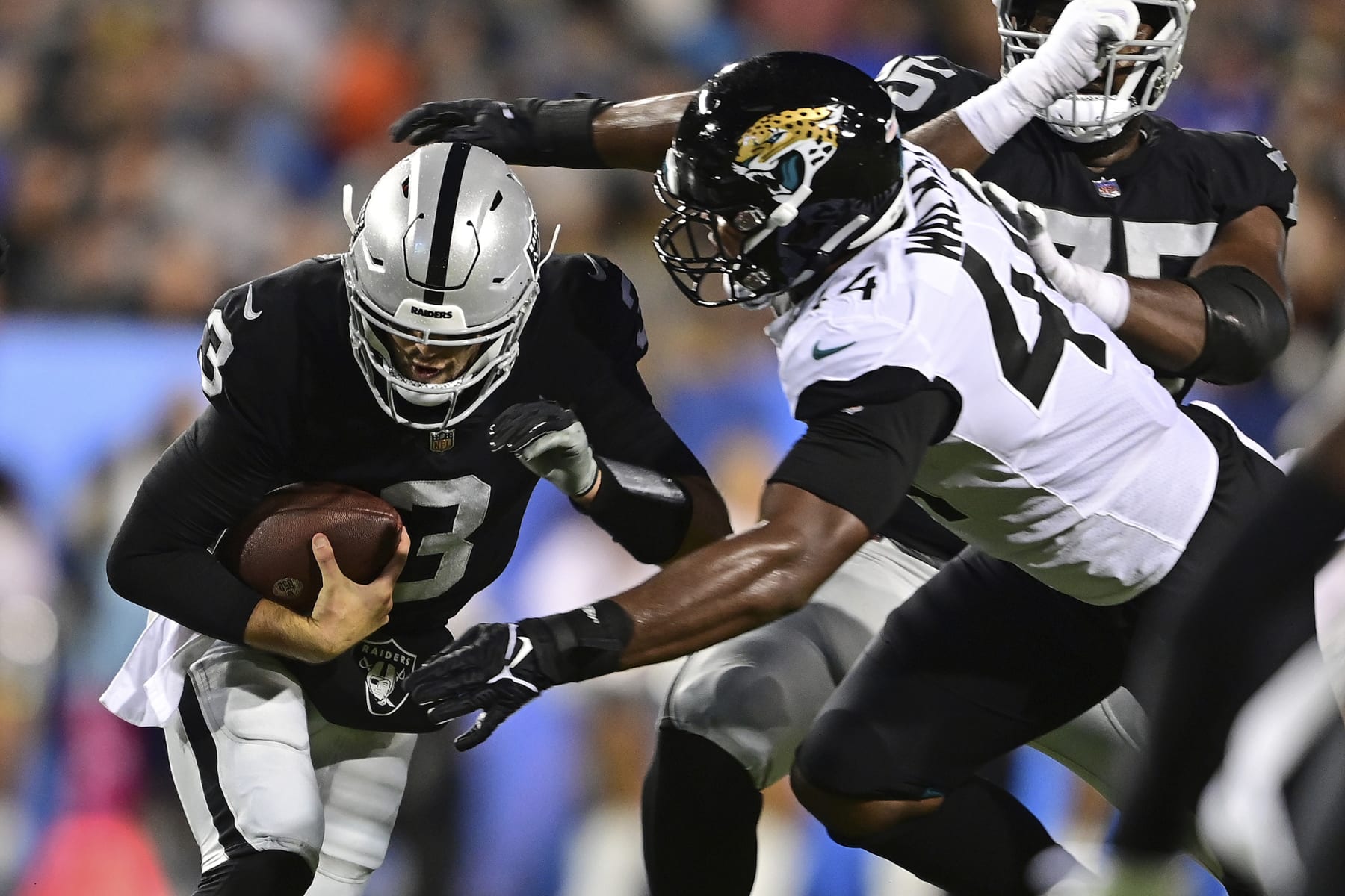Las Vegas Raiders quarterback Jarrett Stidham (3) is sacked by Jacksonville Jaguars linebacker Travon Walker (44) during the first half of the NFL football exhibition Hall of Fame Game, Thursday, Aug. 4, 2022, in Canton, Ohio. (AP Photo/David Dermer)