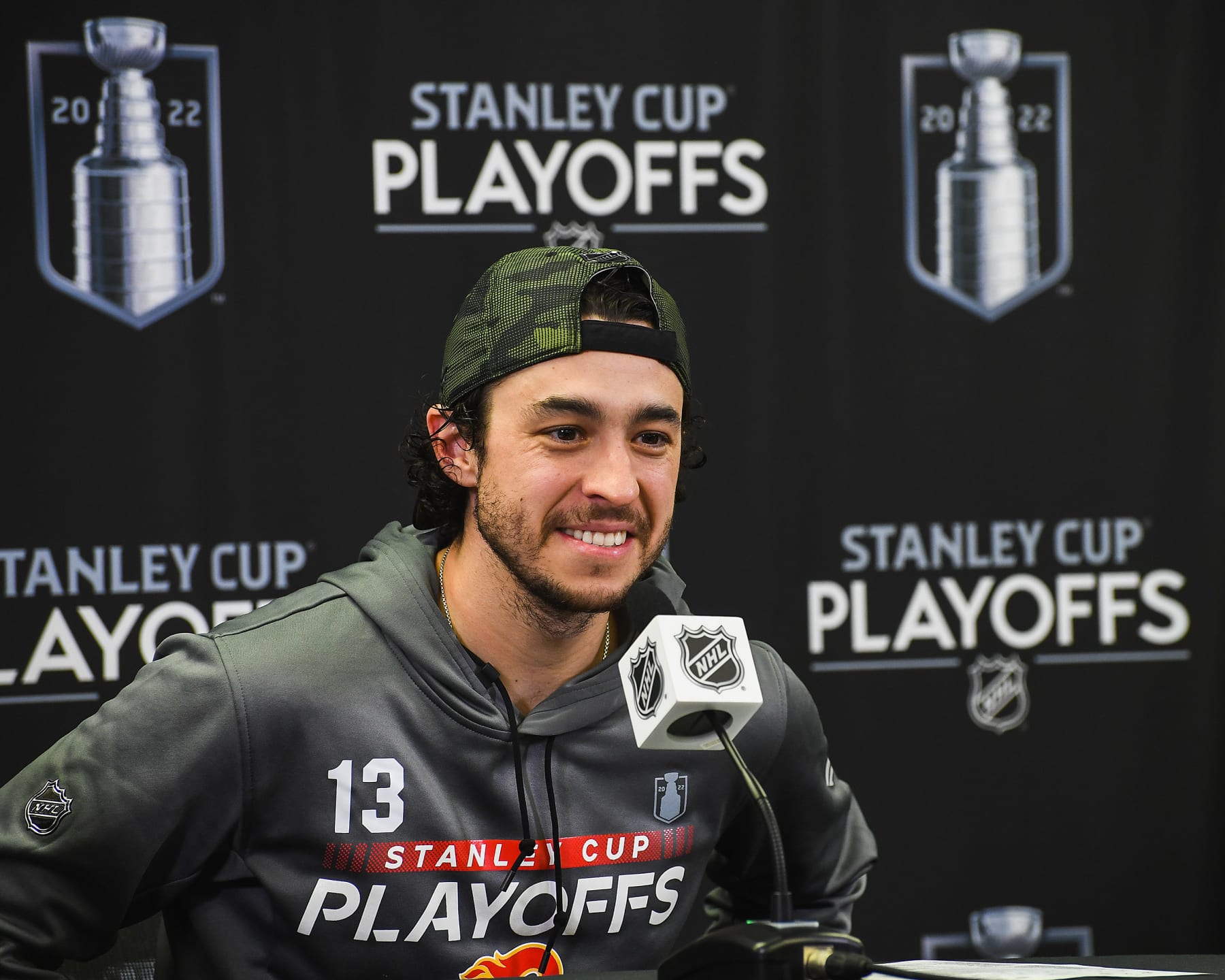 CALGARY, AB - MAY 15: Johnny Gaudreau #13 of the Calgary Flames speaks to media after the Flames defeated the Dallas Stars during the overtime period of Game Seven of the First Round of the 2022 Stanley Cup Playoffs at Scotiabank Saddledome on May 15, 2022 in Calgary, Alberta, Canada. The Flames defeated the Stars 3-2 in overtime. (Photo by Derek Leung/Getty Images)