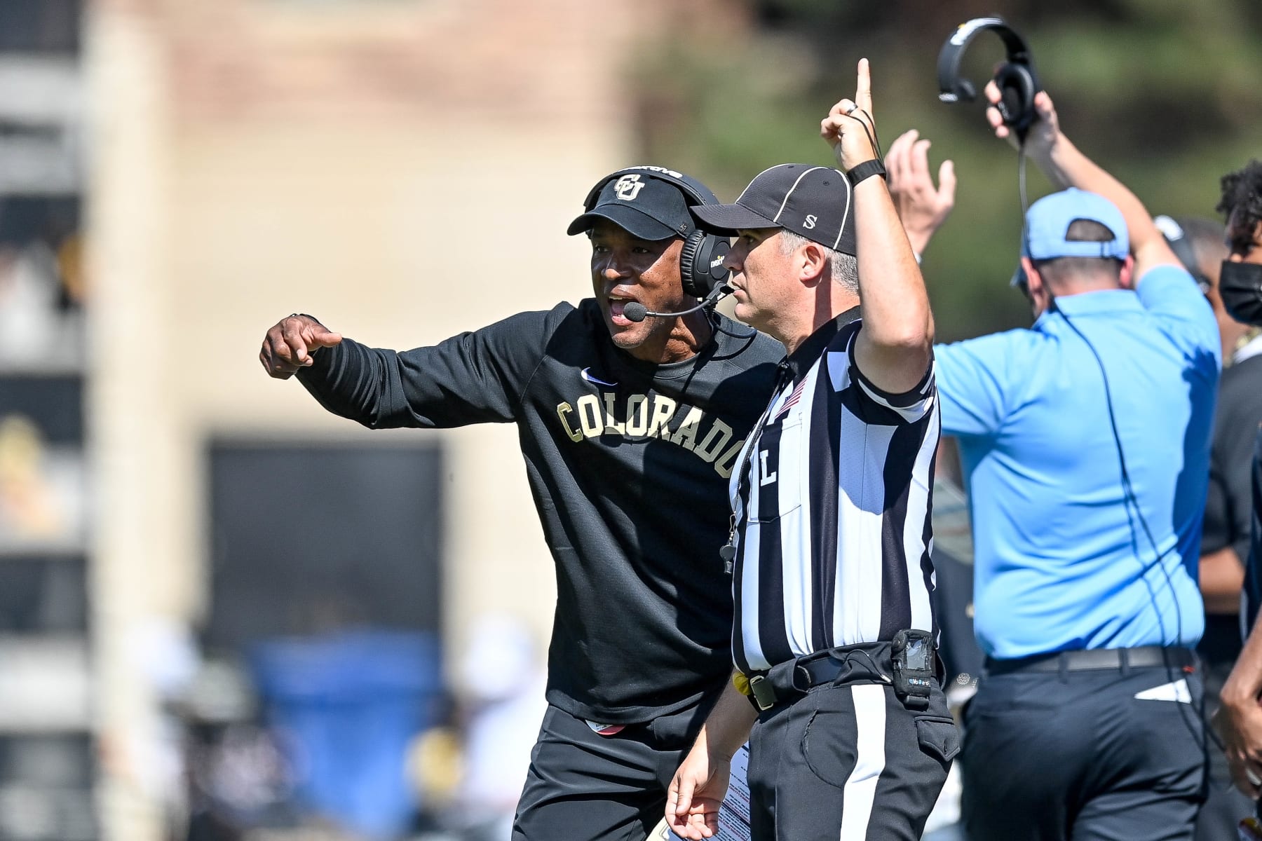 BOULDER, CO - OCTOBER 2: Head coach Karl Dorrell of the Colorado Buffaloes talks to a referee in the first quarter of a game against the USC Trojans at Folsom Field on October 2, 2021 in Boulder, Colorado. (Photo by Dustin Bradford/Getty Images)