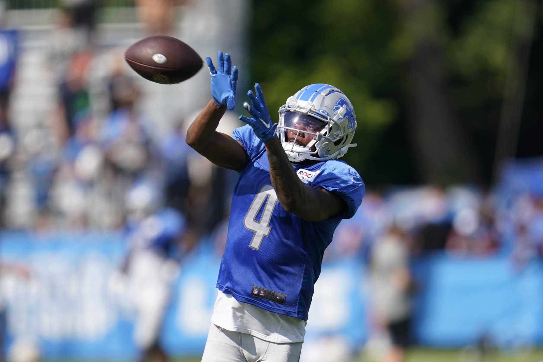 Los Angeles Rams defensive end Doug Reed is held by Detroit Lions News  Photo - Getty Images